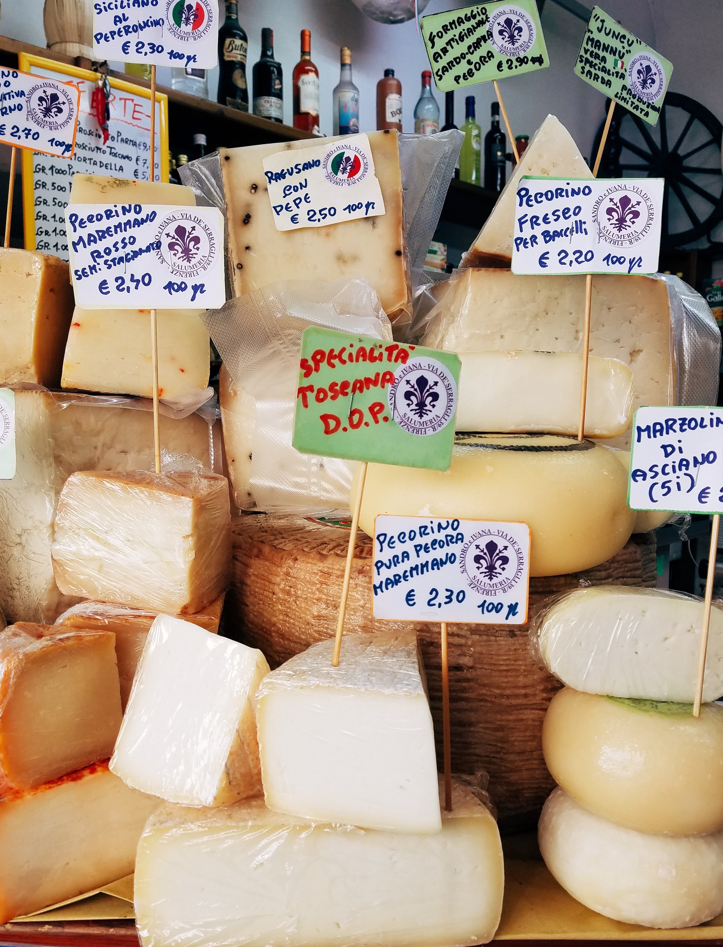 stacks of cheese in Italian market