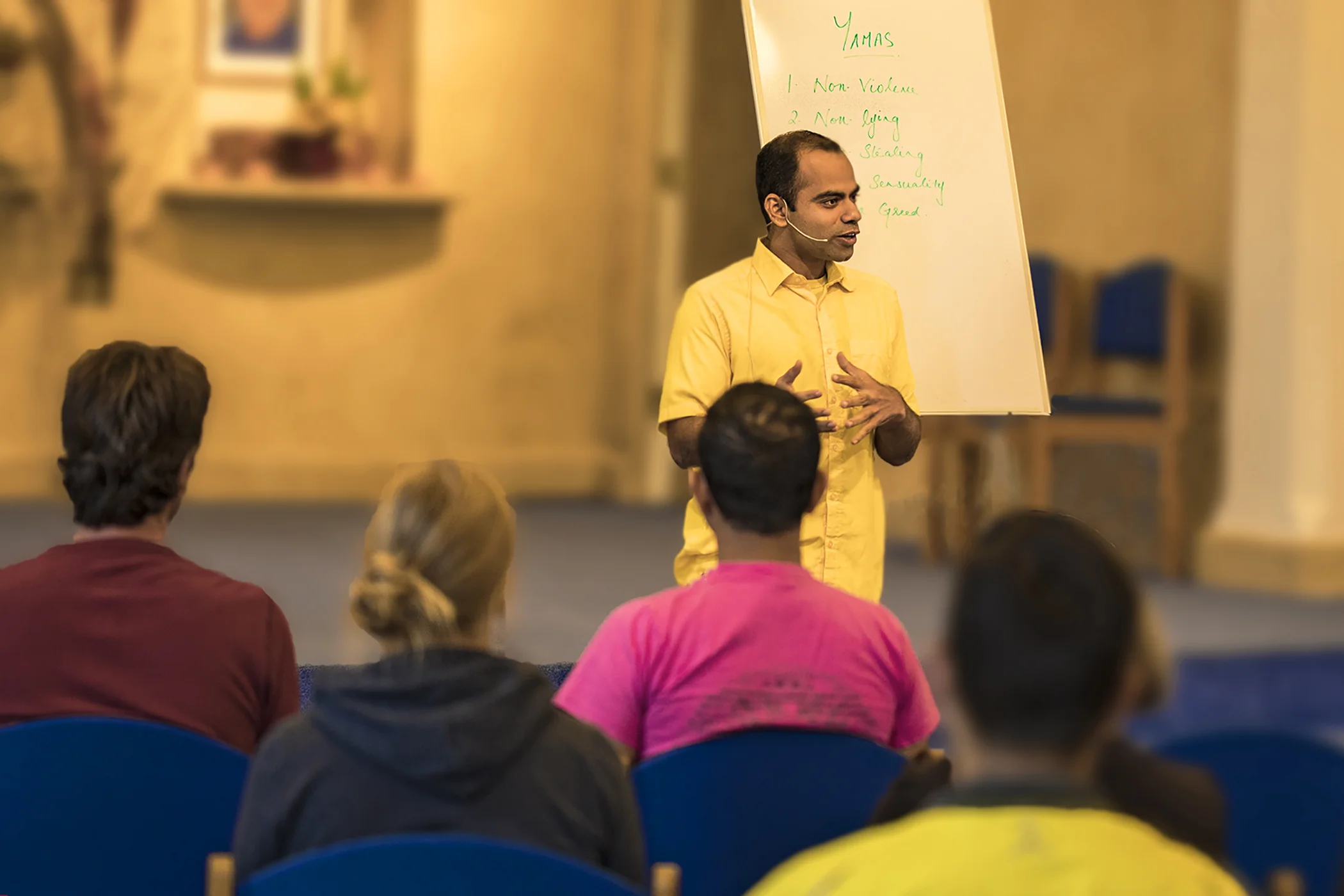 Saiganesh teaching white board behind.jpg