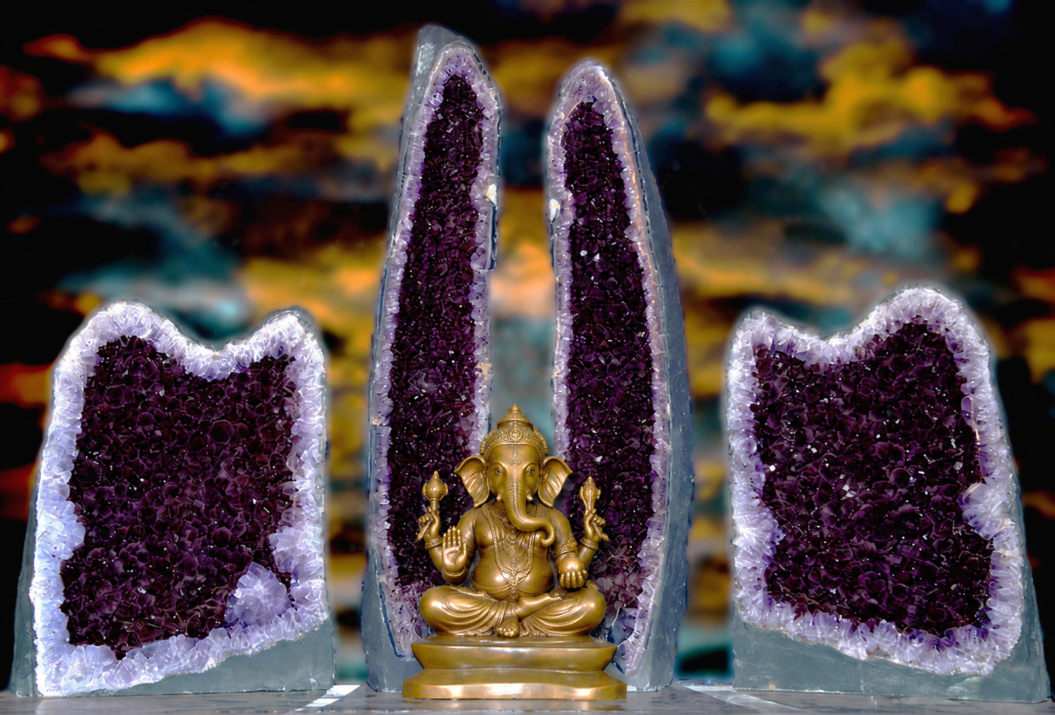 Golden Ganesha Among Purple Amethyst Geodes.png