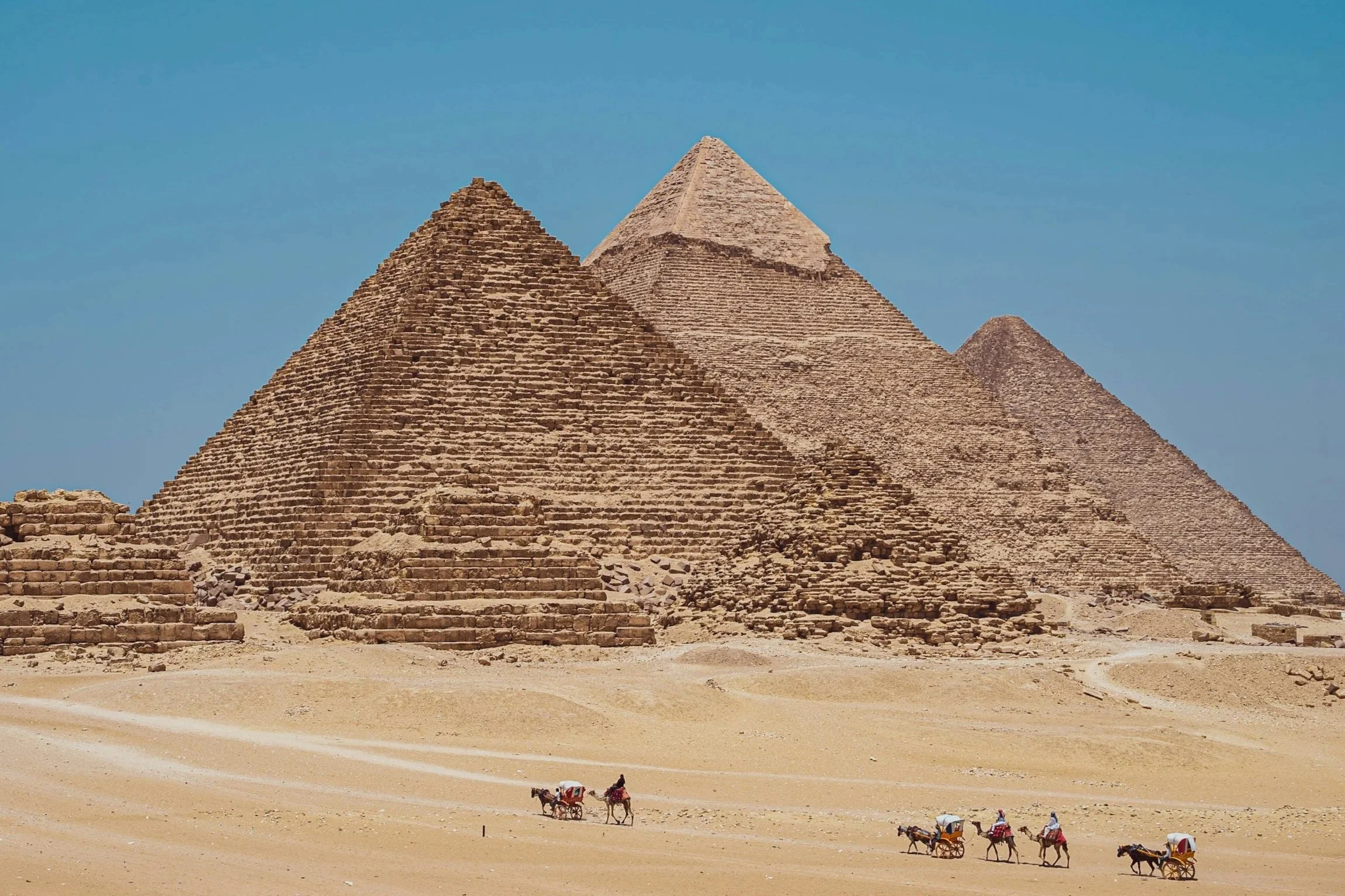 Pyramids of Giza with a camel caravan, Egypt