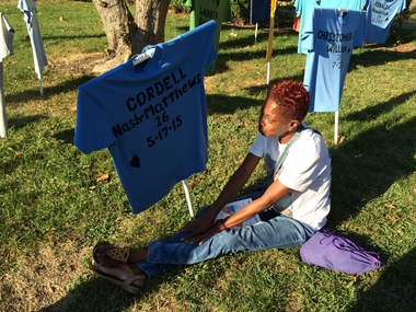 Robin Nash mourns in front of the T-shirt bearing her late son's name during a Harrisburg vigil calling for an end to gun violence on Thursday..jpg