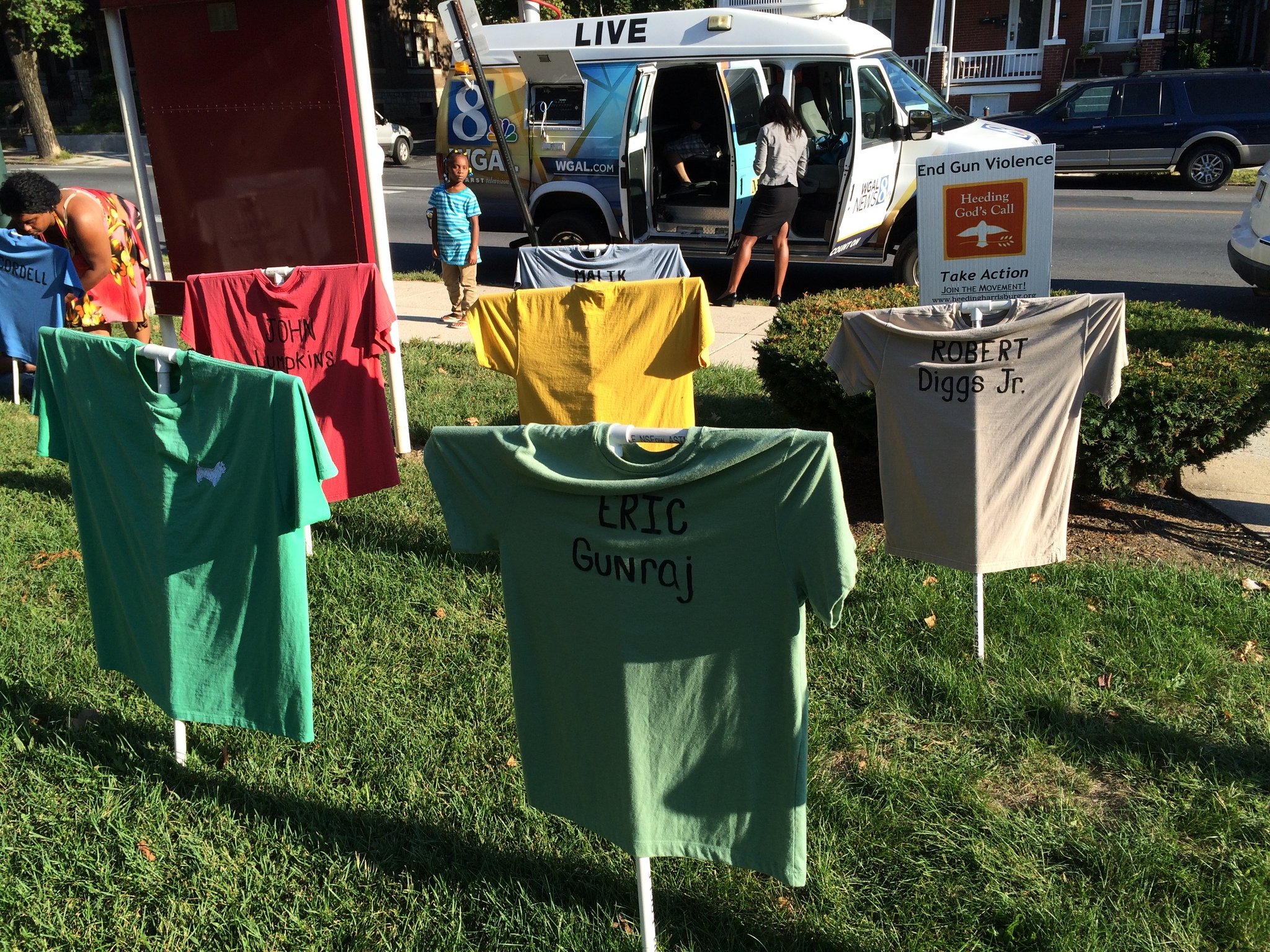 T-shirt memorial bearing the names of 72 killed by guns since 2009 served as the backdrop to a vigil calling for peace held Thursday at St. Andrews Episcopal Church in Harrisburg.jpg