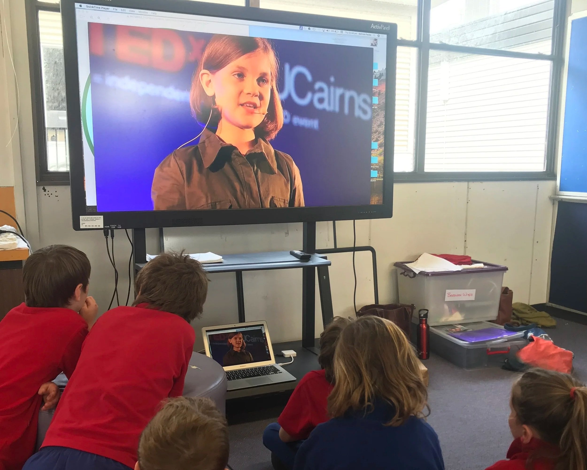 students watching video on screen