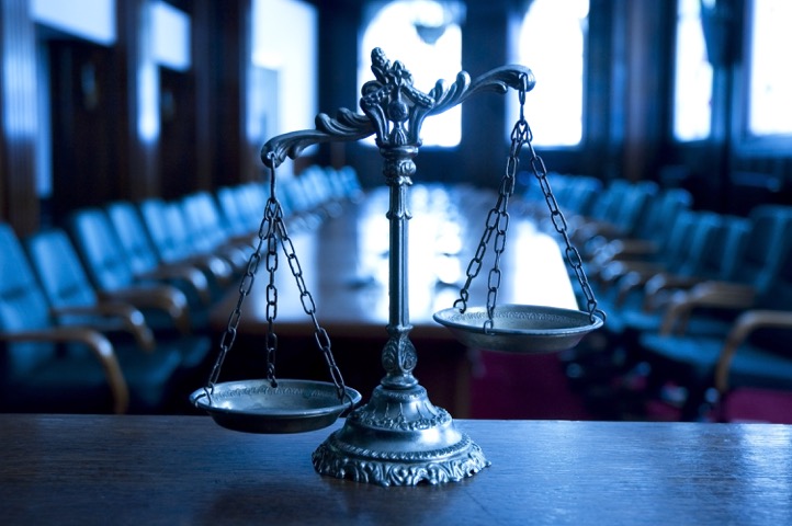 Scales-of-Justice-in-courtroom.jpeg