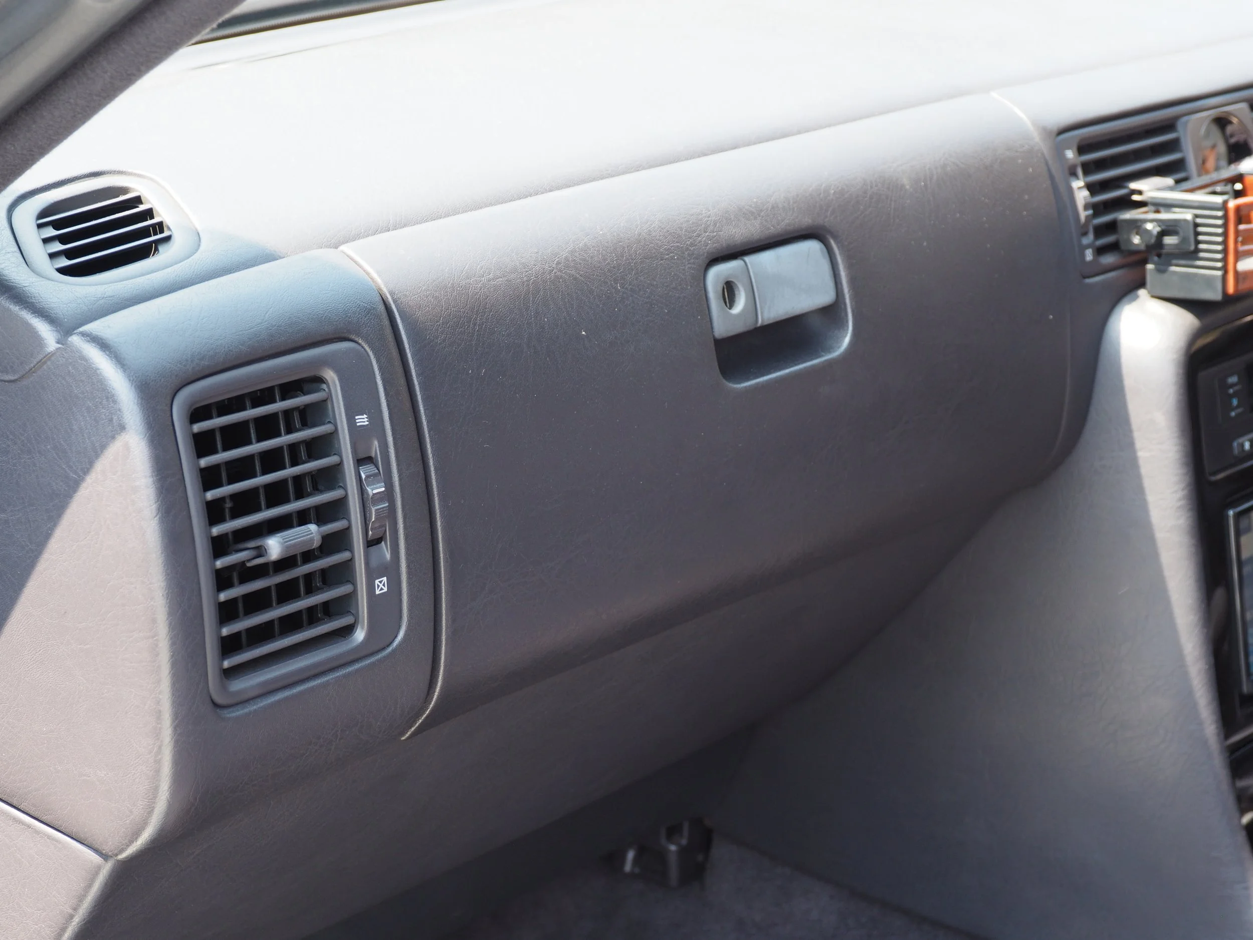 There is a small period correct TV hidden in the glove box