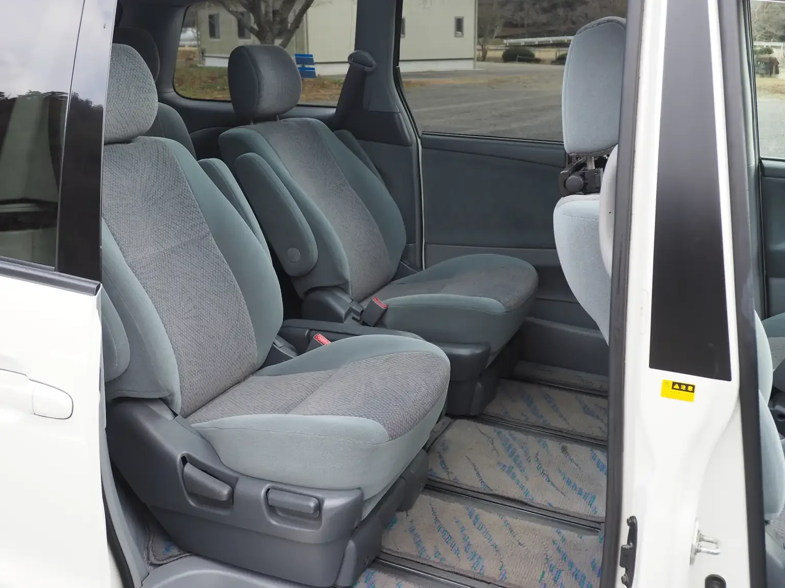 Interior shot showing 2nd row seats with rear slider door open 2001 Toyota Estima Aeras L Japan export inventory for sale