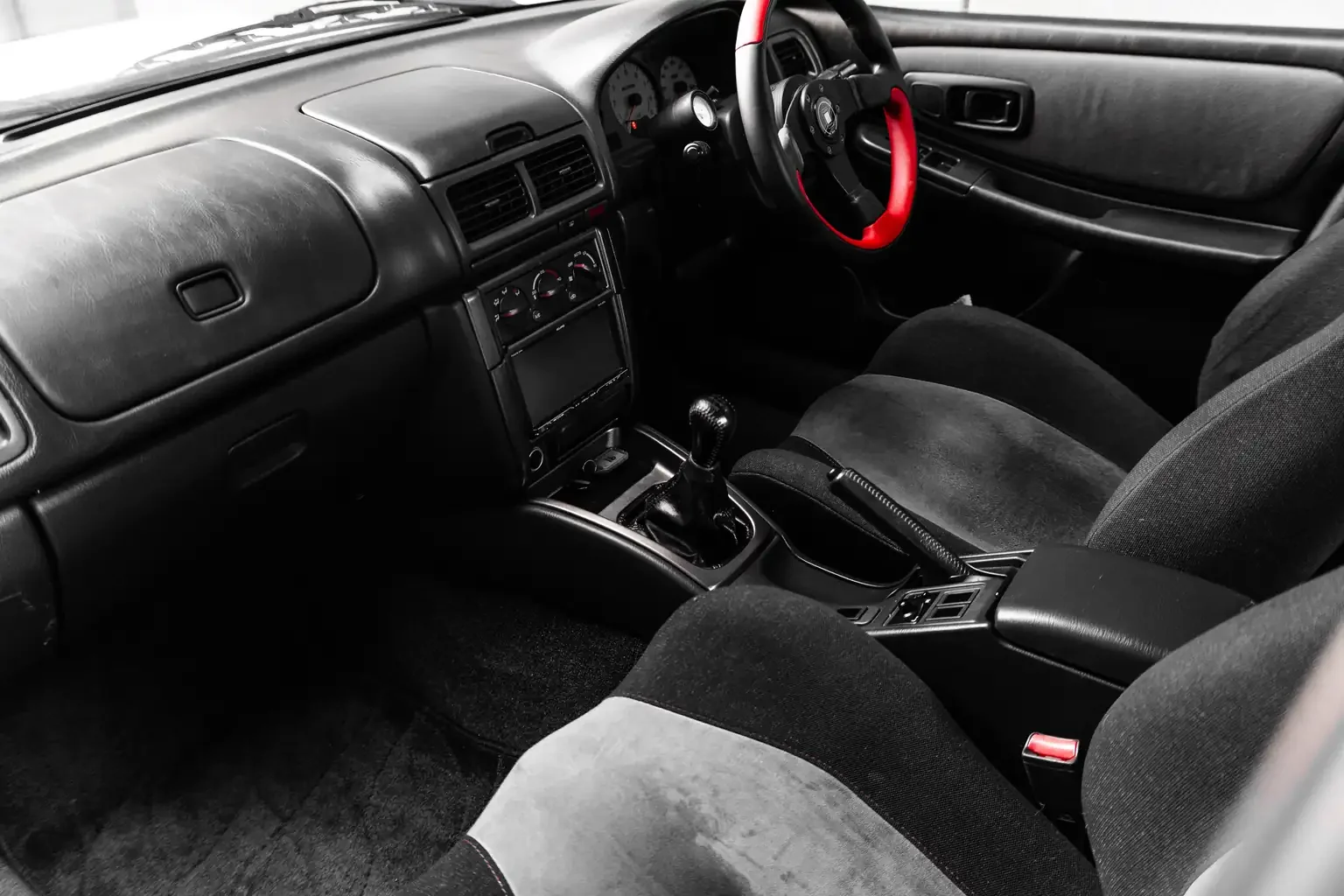 passengers side view of seat and dash on low milage jdm gc8 subaru impreza WRX STi version 4 1998 Japanese vehicle for export sale New Zealand