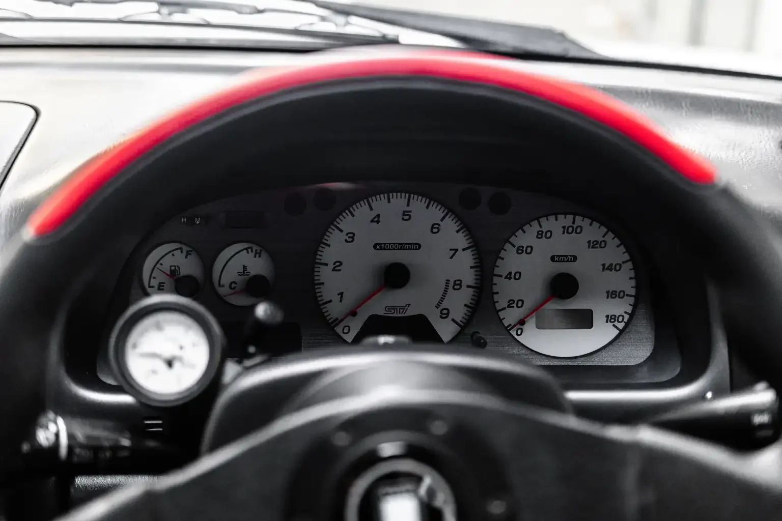 After market red and black nardi steering wheel and factory boost gauge on gc8 wrx sti version 4