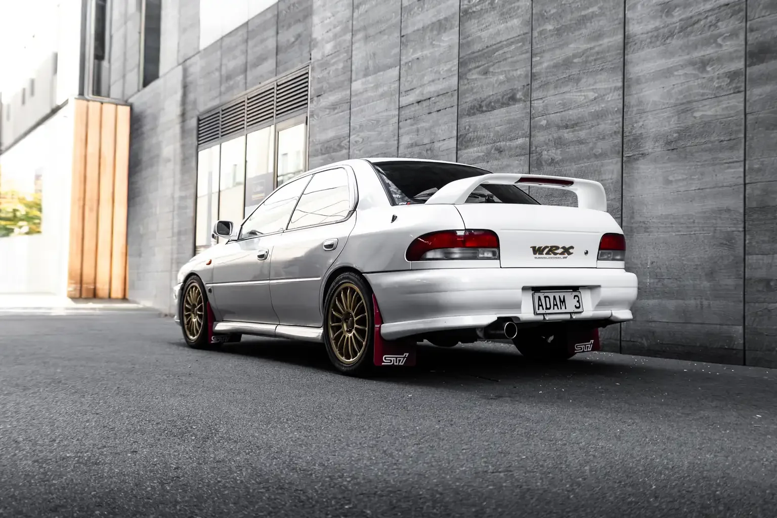 Rear passengers side angle white subaru impreza WRX STi version 4 1998 JDM export vehicle for sale New Zealand