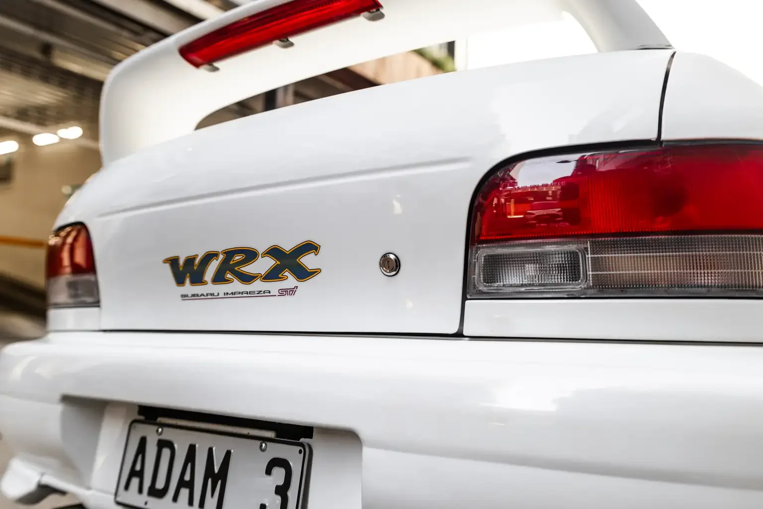 rear end showing spoiler and wrx decal gc8 subaru impreza WRX STi version 4 1998 JDM vehicle for export sale New Zealand