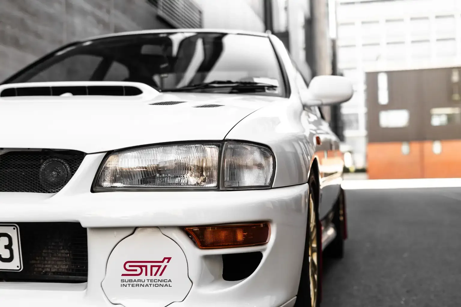 front bottom passengers side half shot on white gc8 subaru impreza WRX STi version 4 1998 JDM vehicle for export sale New Zealand
