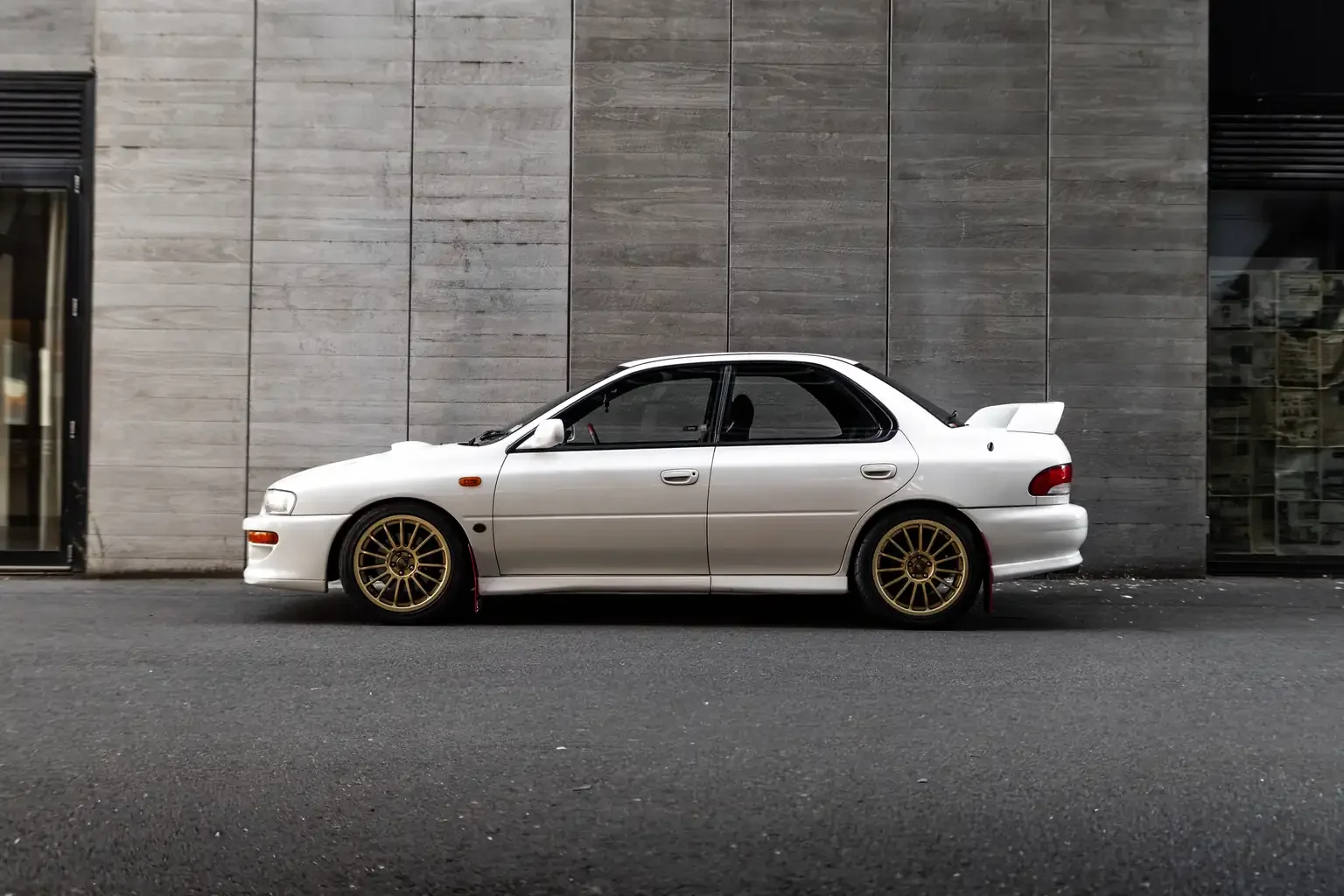 side shot white gc8 subaru impreza WRX STi version 4 1998 JDM vehicle for export sale New Zealand