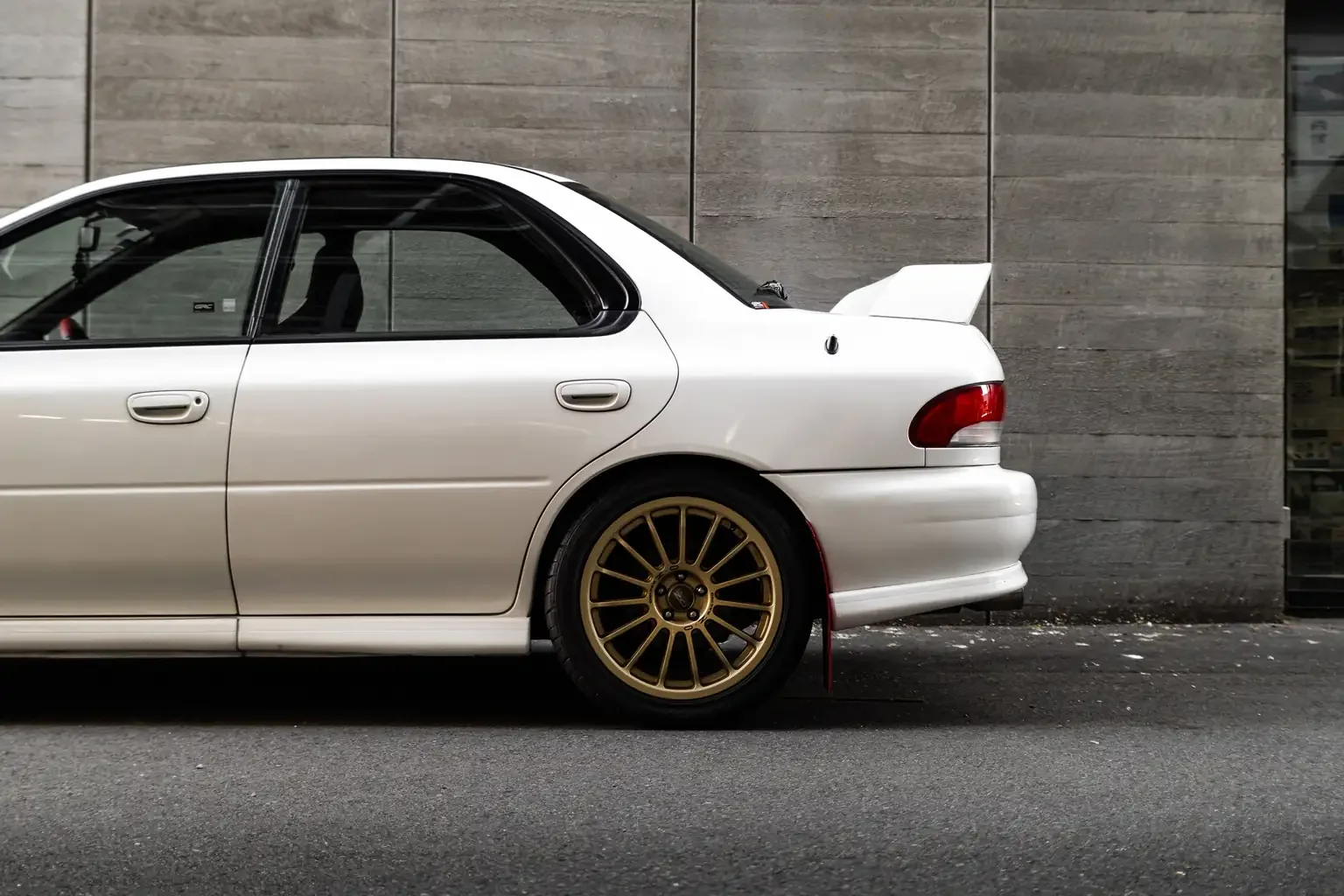 side shot rear half white gc8 subaru impreza WRX STi version 4 1998 JDM vehicle for export sale New Zealand