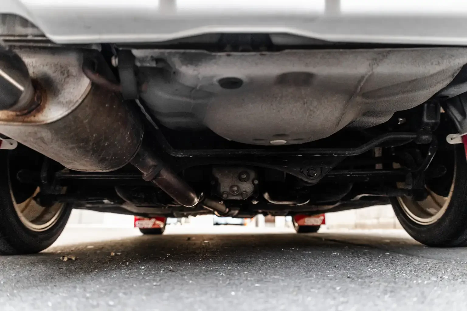 rear floor undercarriage inspection showing differential and exhaust on rust free gc8 subaru impreza WRX STi version 4 1998 JDM vehicle for export sale New Zealand