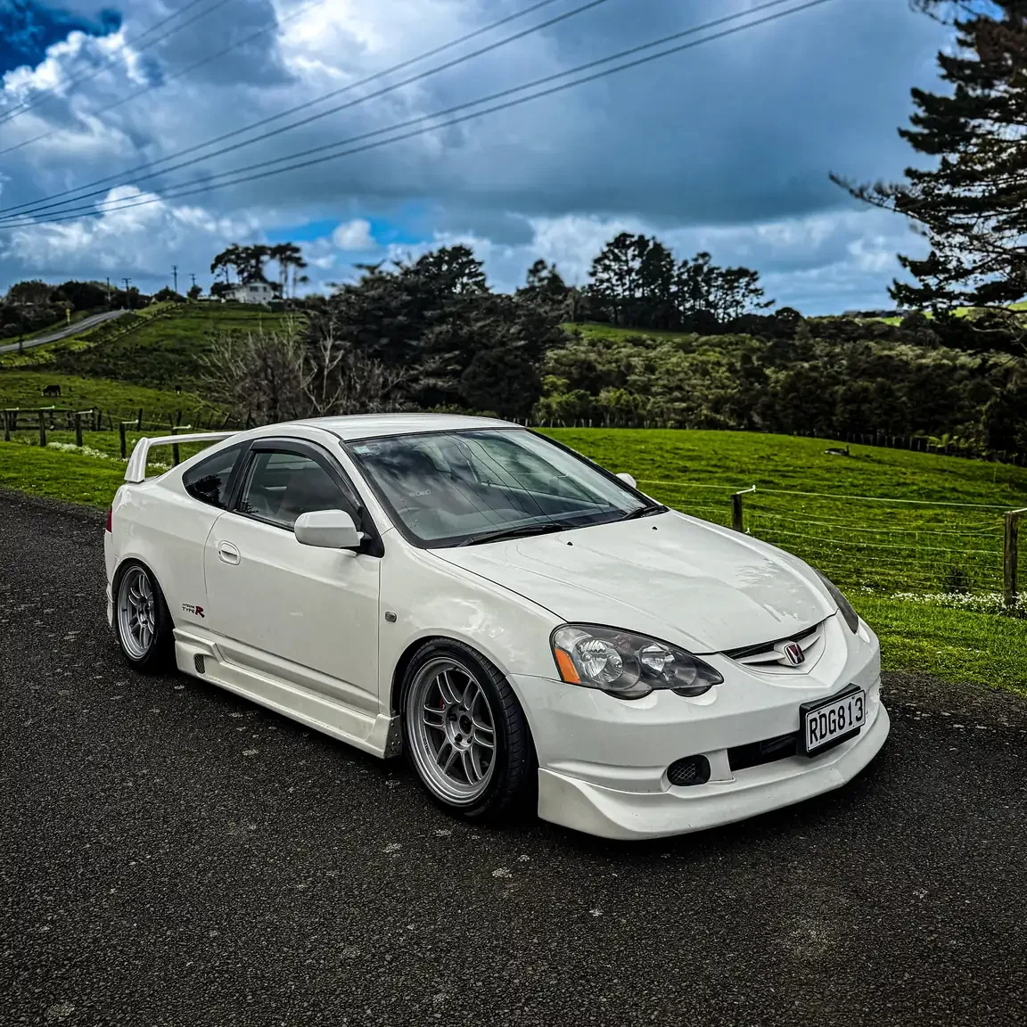 Front drivers side angle view of white 2001 DC5 Honda Integra Type R JDM export vehicle for sale New Zealand