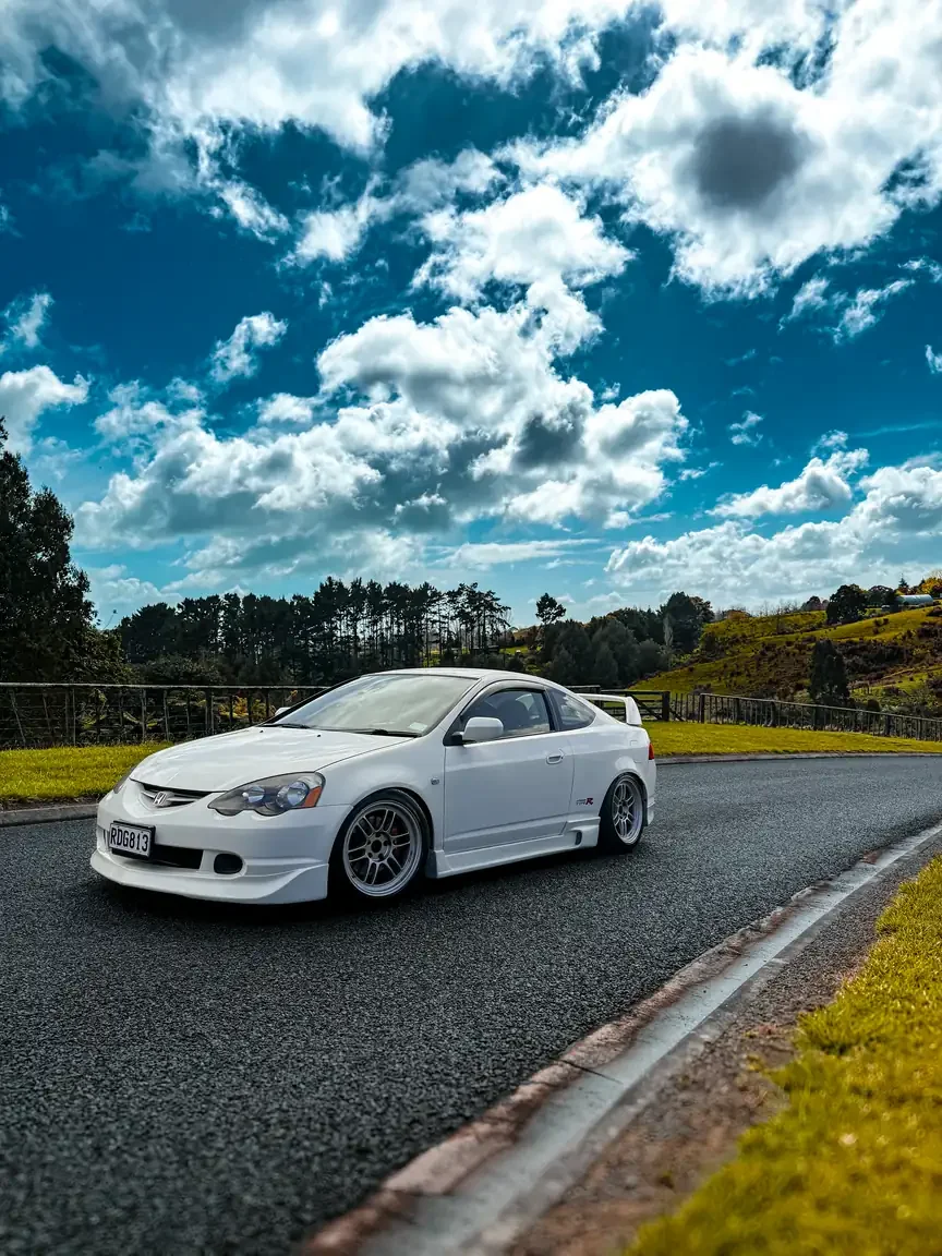Front passengers side angle shot of modified white 2001 DC5 Honda Integra Type R JDM export vehicle for sale New Zealand