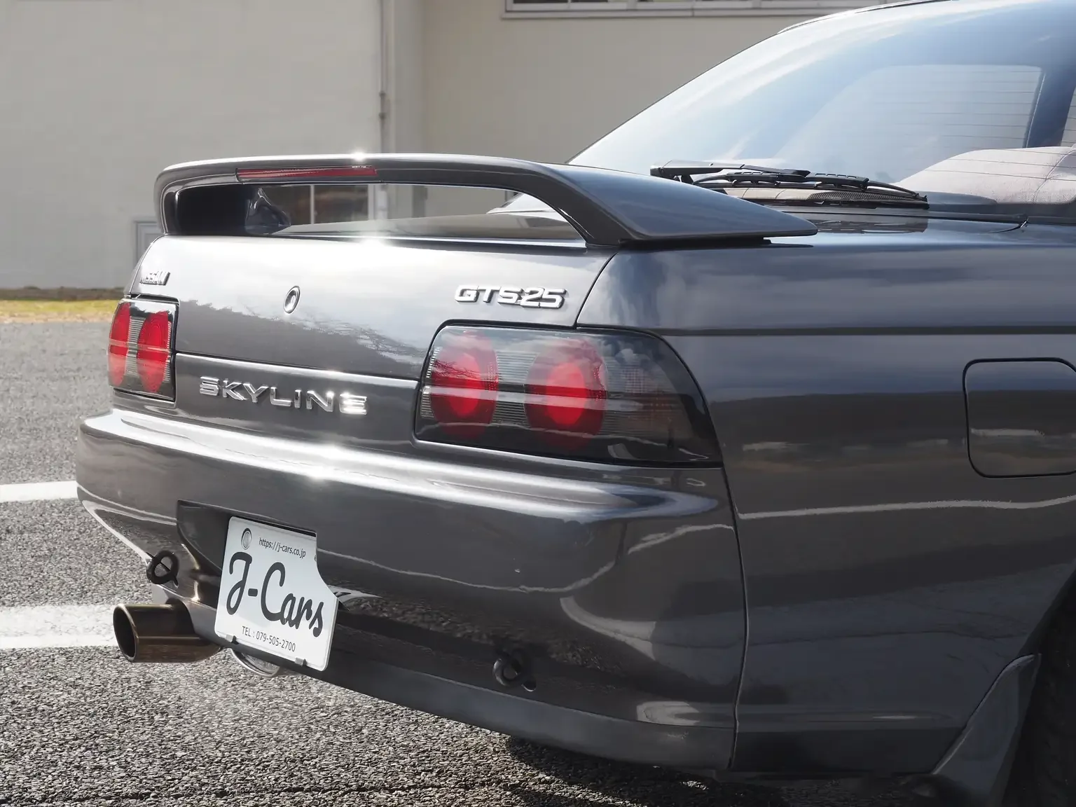 Passengers rear side view rear end 1991 Nissan Skyline GTS25 Type X G 4 Door Sedan for export from Japan