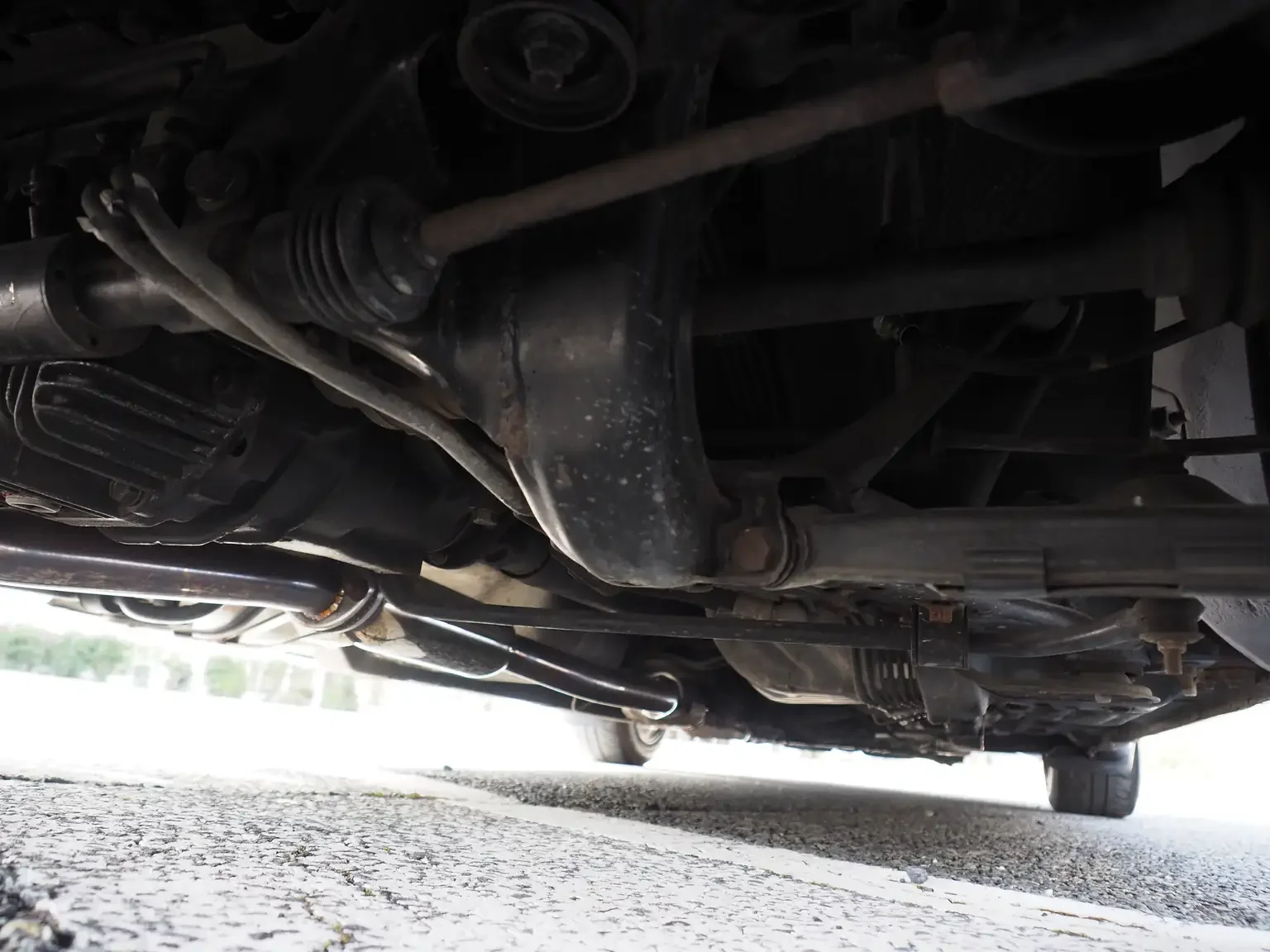 Undercarriage view showing undamaged and rust free subframe 1991 Nissan Skyline GTS25 Type X G 4 Door Sedan for export from Japan