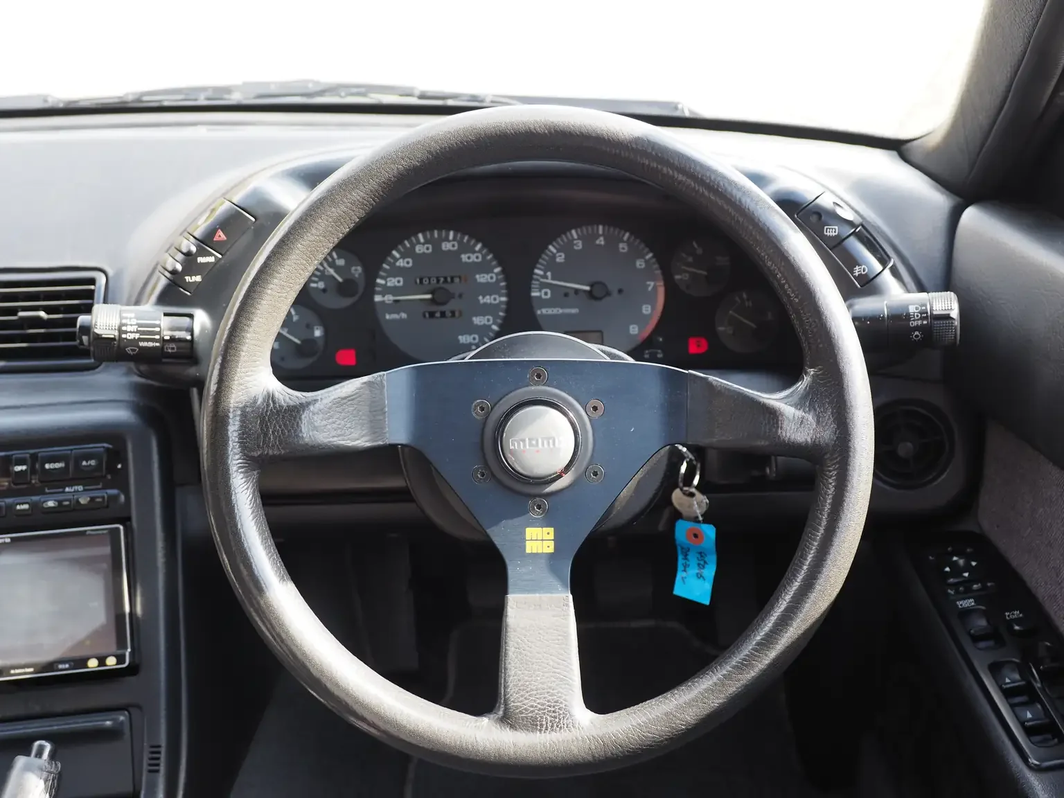 Drivers seat position view racing steering wheel and instrument panel 1991 Nissan Skyline GTS25 Type X G 4 Door Sedan for export from Japan