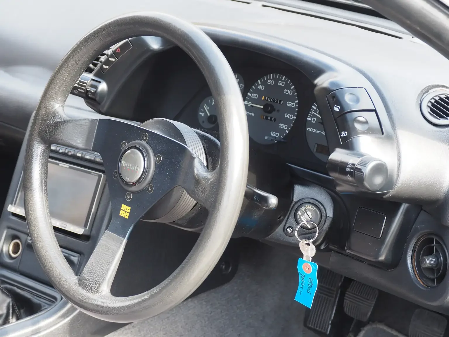 Interior view of Momo steering wheel 1991 Nissan Skyline GTS25 Type X G 4 Door Sedan for export from Japan