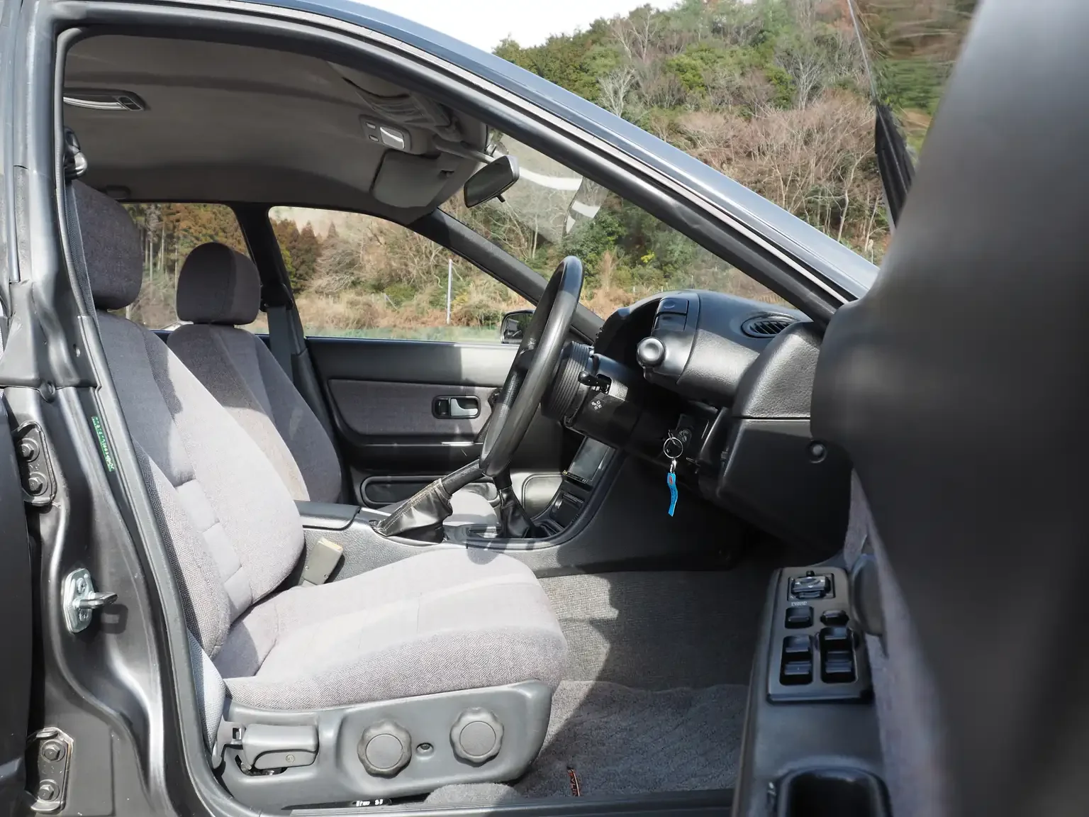 Drivers side view front drivers seat grey cloth 1991 Nissan Skyline GTS25 Type X G 4 Door Sedan for export from Japan
