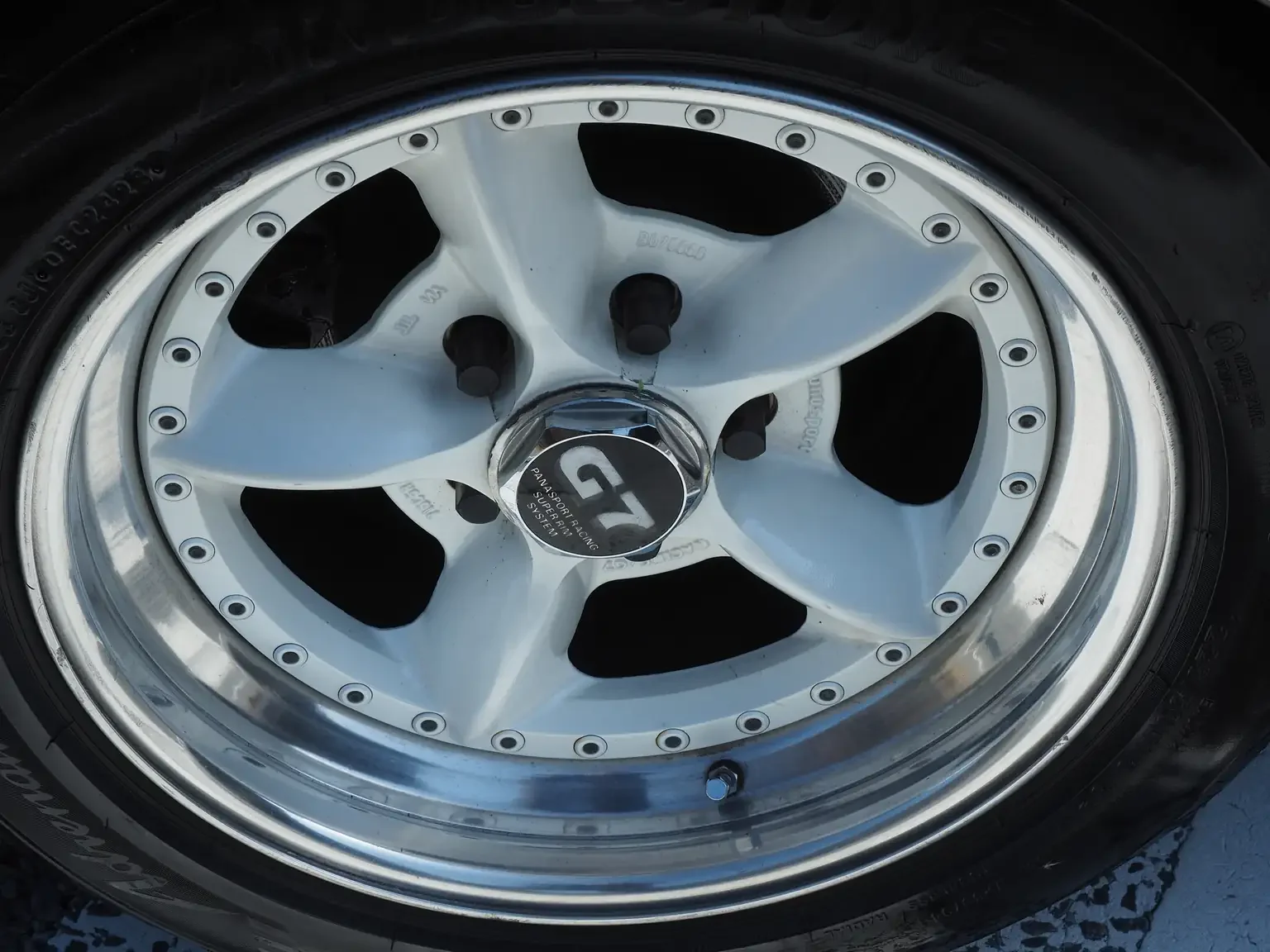 view of panasport g7 C5R 3 piece forged alloy wheels 16 inch fitted on Nissan 200zr JDM for export from Japan