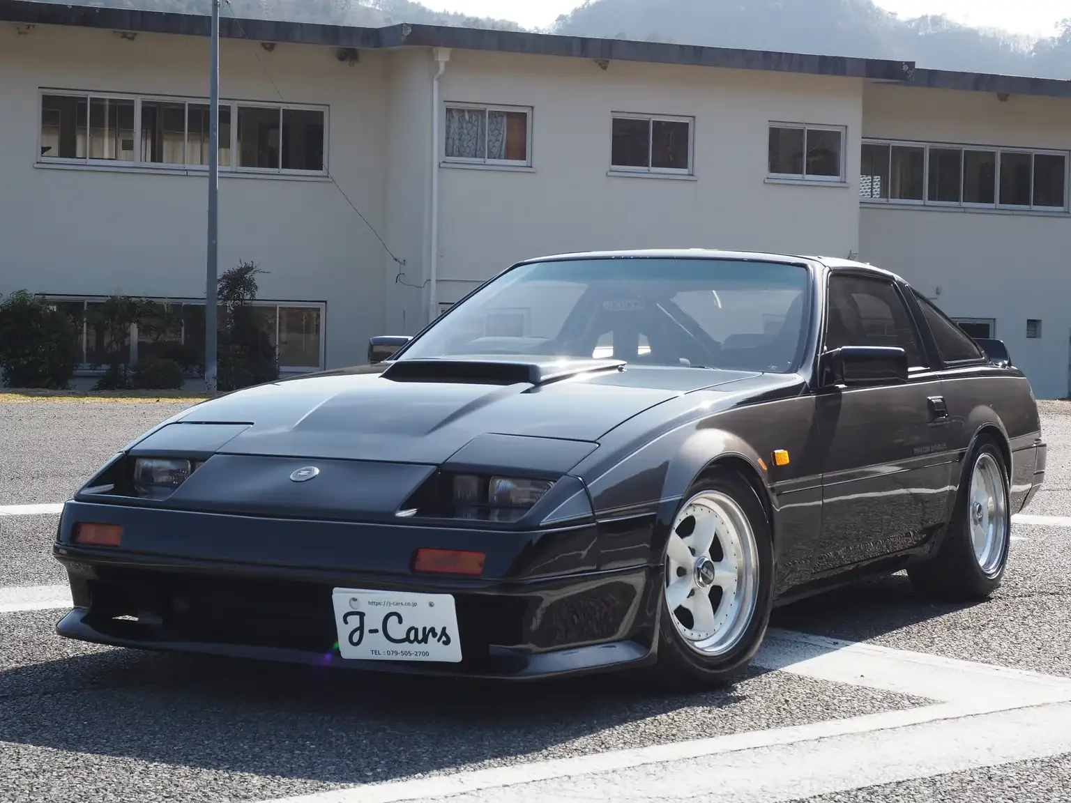 front passengers side angle view black and grey two tone Nissan fairlady z 200zr 2 seater JDM for export from Japan