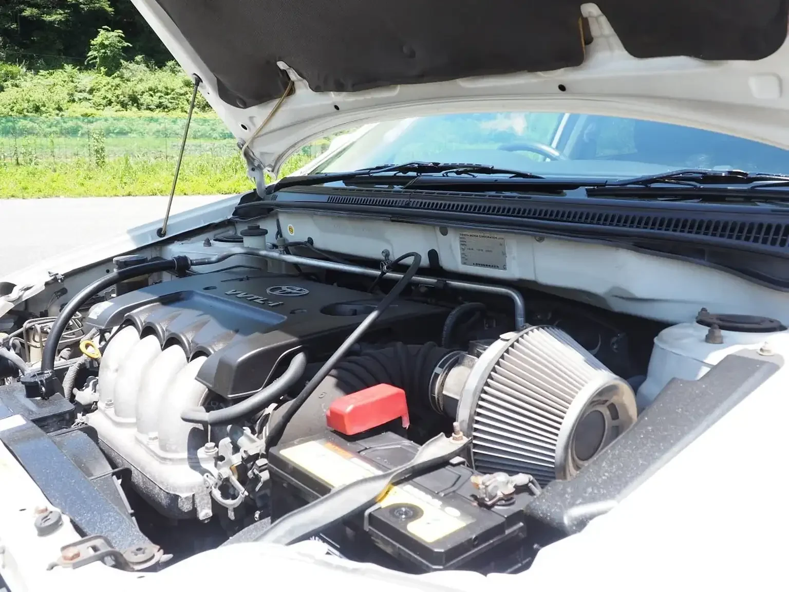 blitz air filter kit installed in engine bay of white toyota corolla runx aero tourer z 6 speed zze123 JDM export stock for sale japan