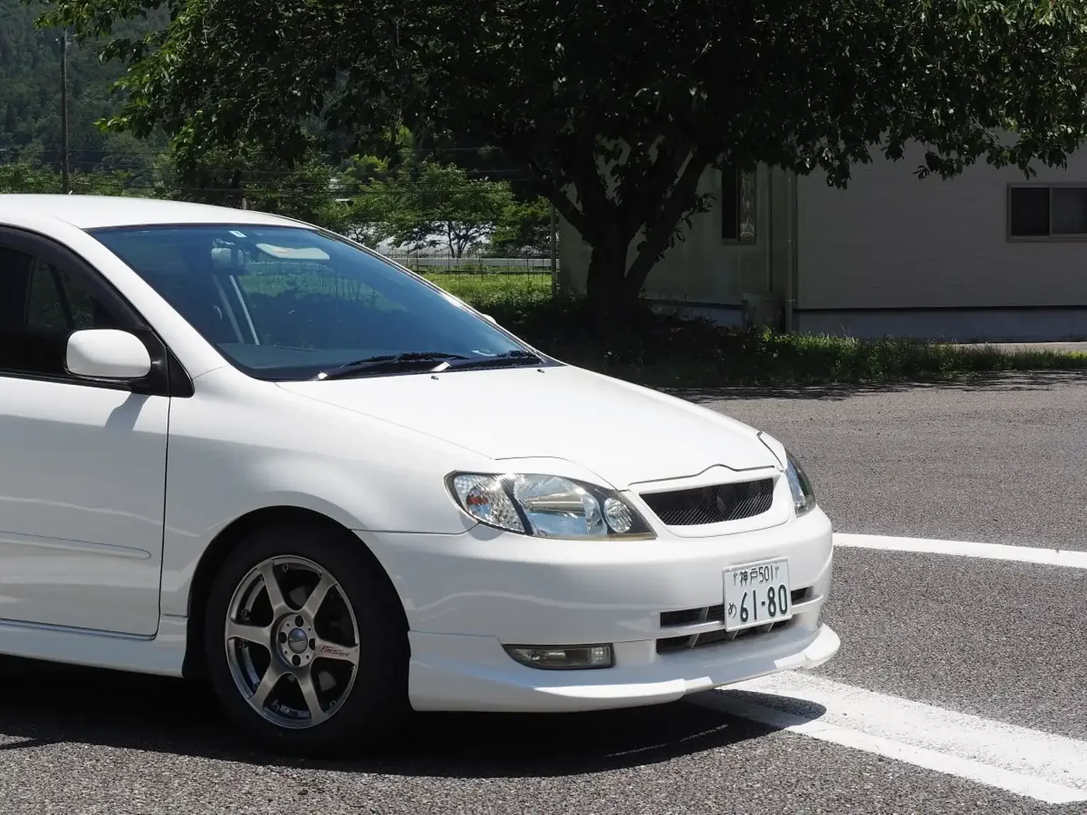 front drivers side view of c-one aero parts on white toyota corolla runx aero tourer z 6 speed zze123 JDM export stock for sale japan