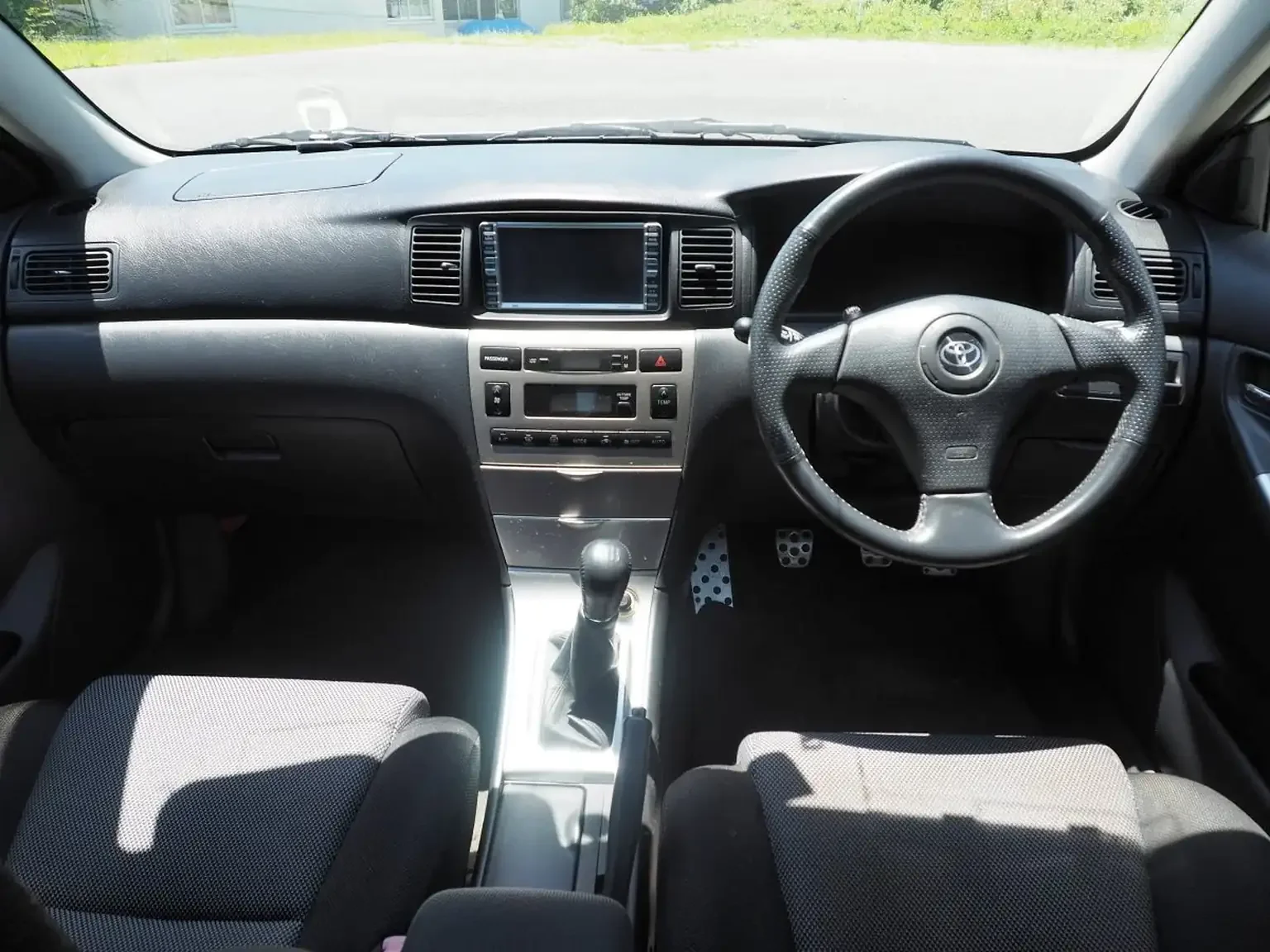 front interior view grey and black interior toyota corolla runx aero tourer z 6 speed zze123 JDM export stock for sale japan
