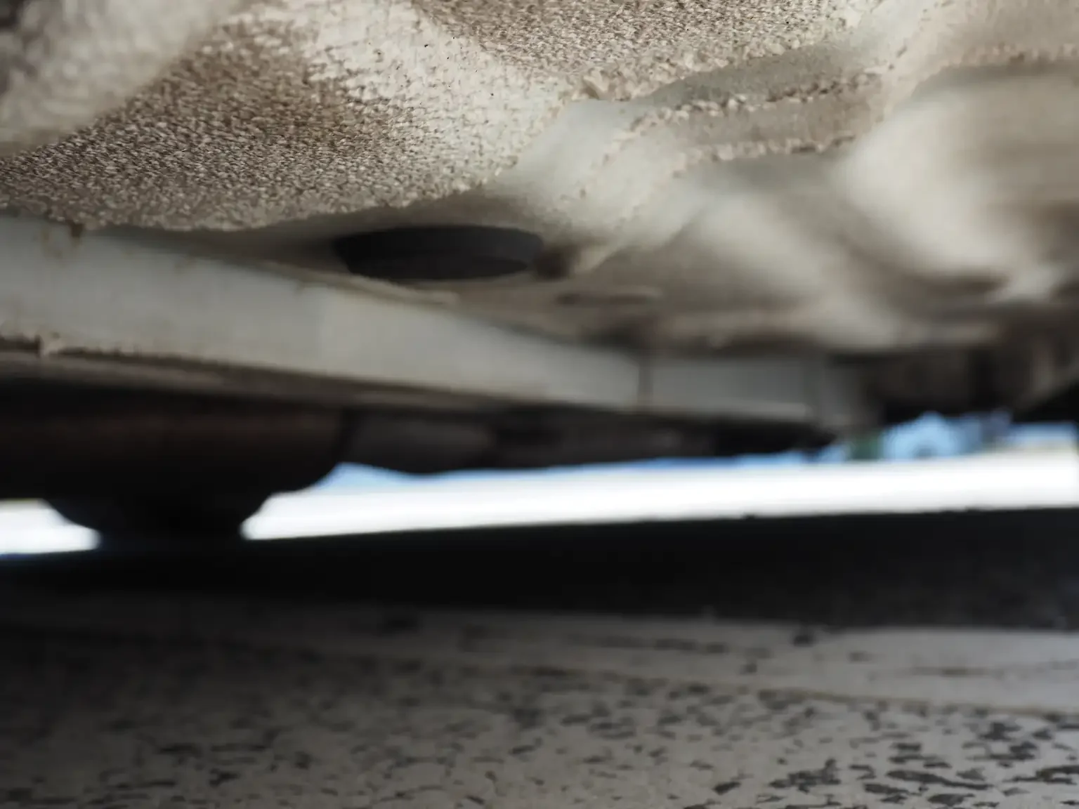 undercarriage view of rust free floor on pearl white toyota crown athlete four estate 2001 jdm export stock japan