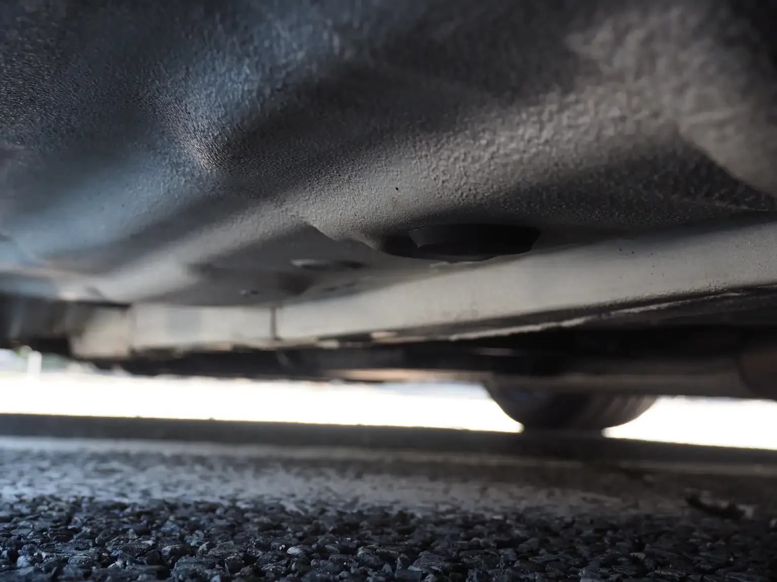 undercarriage view showing rust free condition on pearl white toyota crown athlete four estate 2001 jdm export stock japan