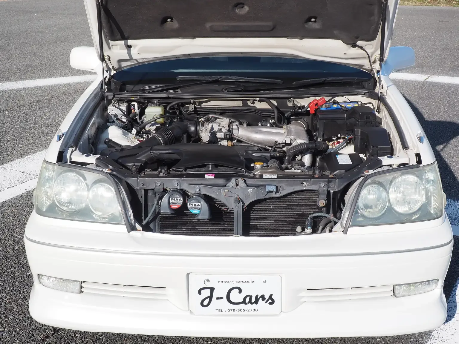 front view with bonnet open showing 1jzge engine pearl white toyota crown athlete four estate 2001 jdm export stock japan