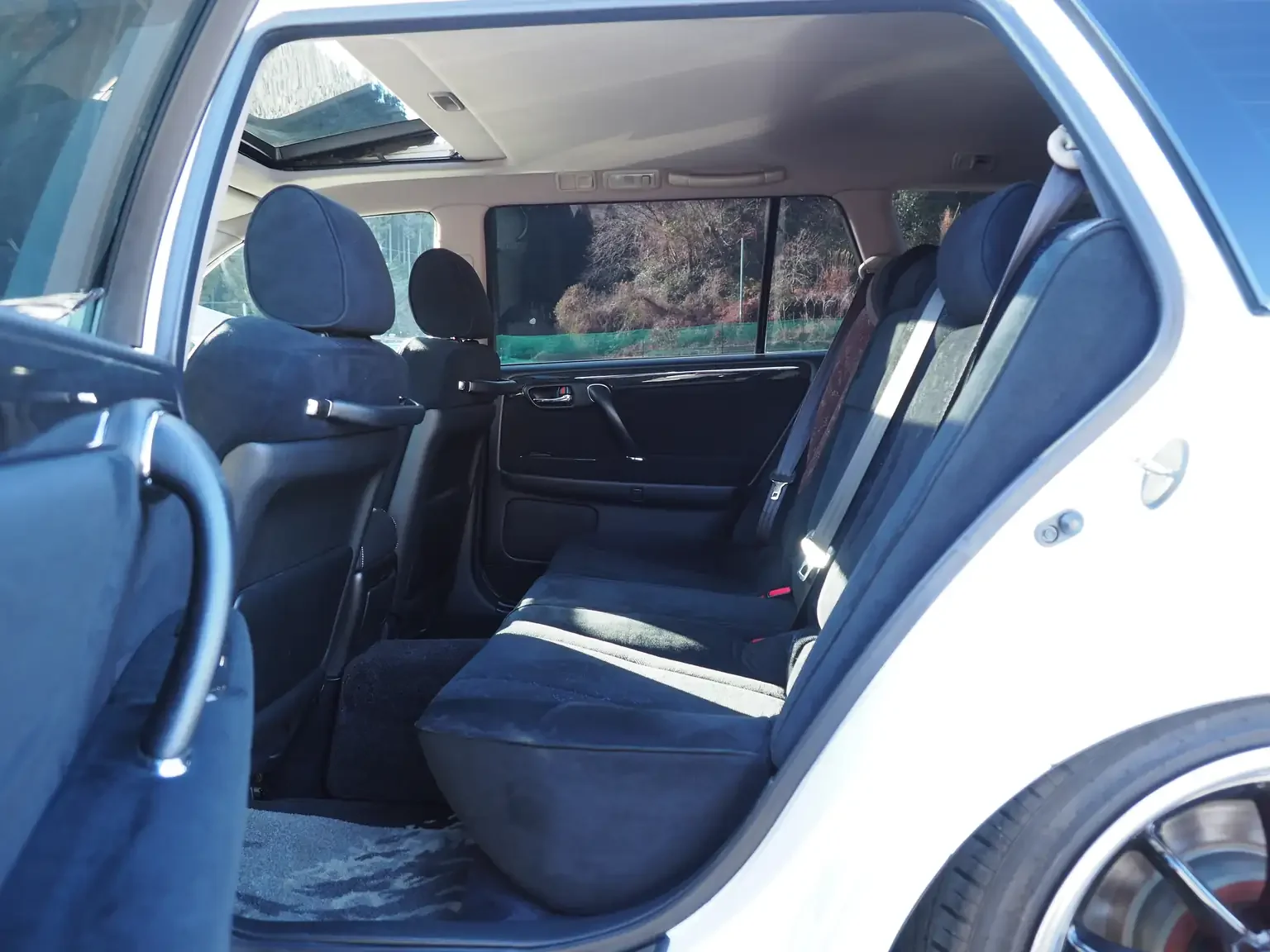 rear passengers seat charcoal interior view toyota crown athlete four estate 2001 jdm export stock japan