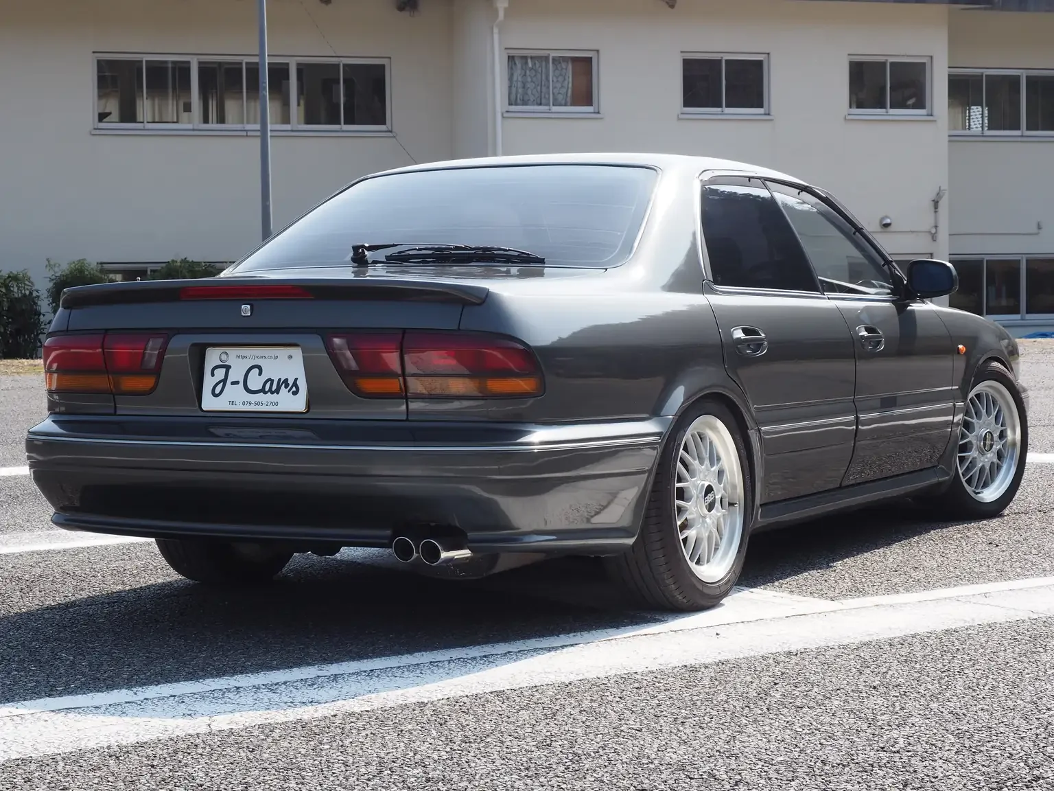 rear-angle-view-drivers-side-1991-mitsubishi-diamante-30rs-grey-jdm-export-vehicle-japan.webp