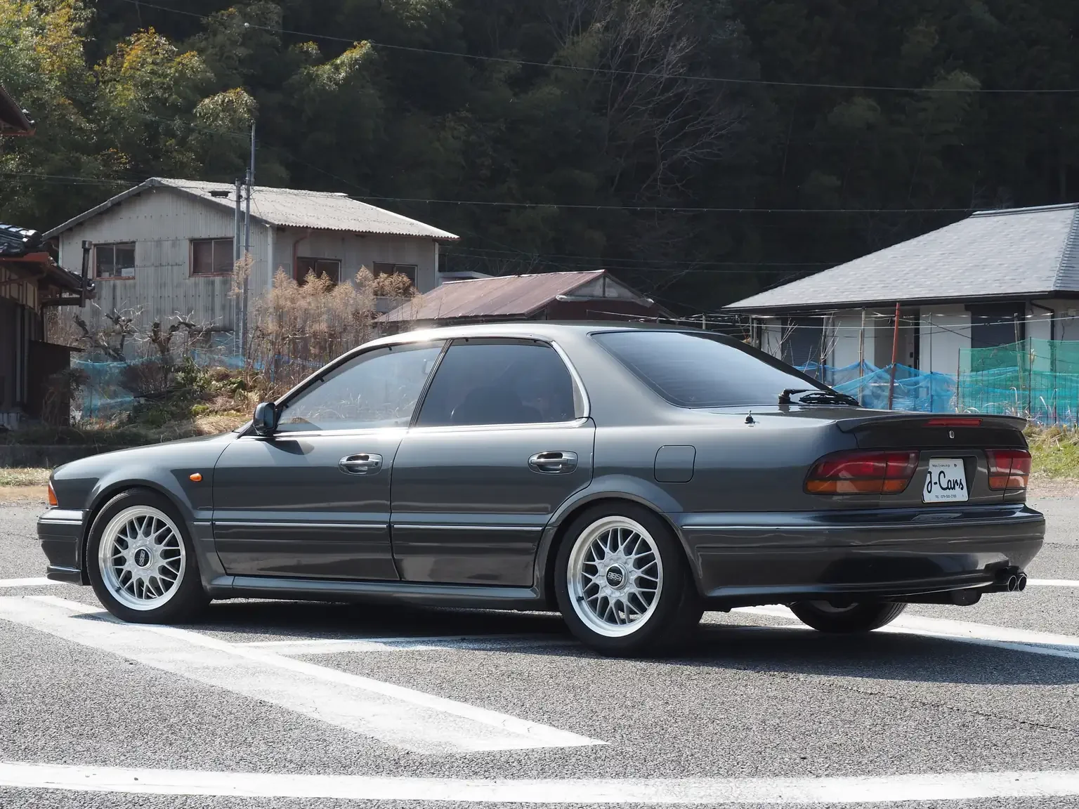 slight-angle-view-from-rear-left-hand-side-1991-mitsubishi-diamante-30rs-grey-jdm-export-vehicle-japan.webp