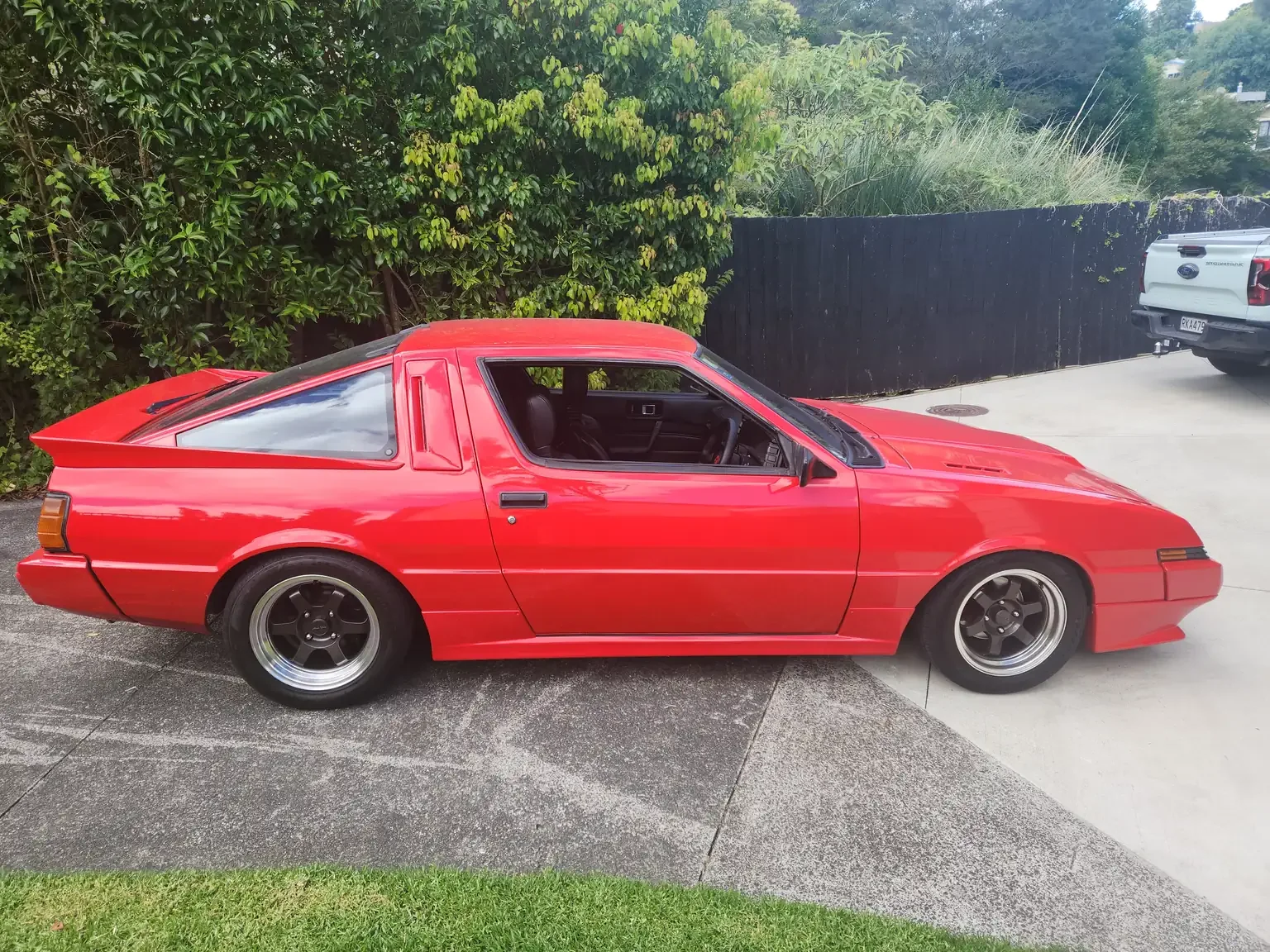 right side view red Mitsubishi Starion GSR II Turbo JDM spec NZ New export vehicle for sale New Zealand