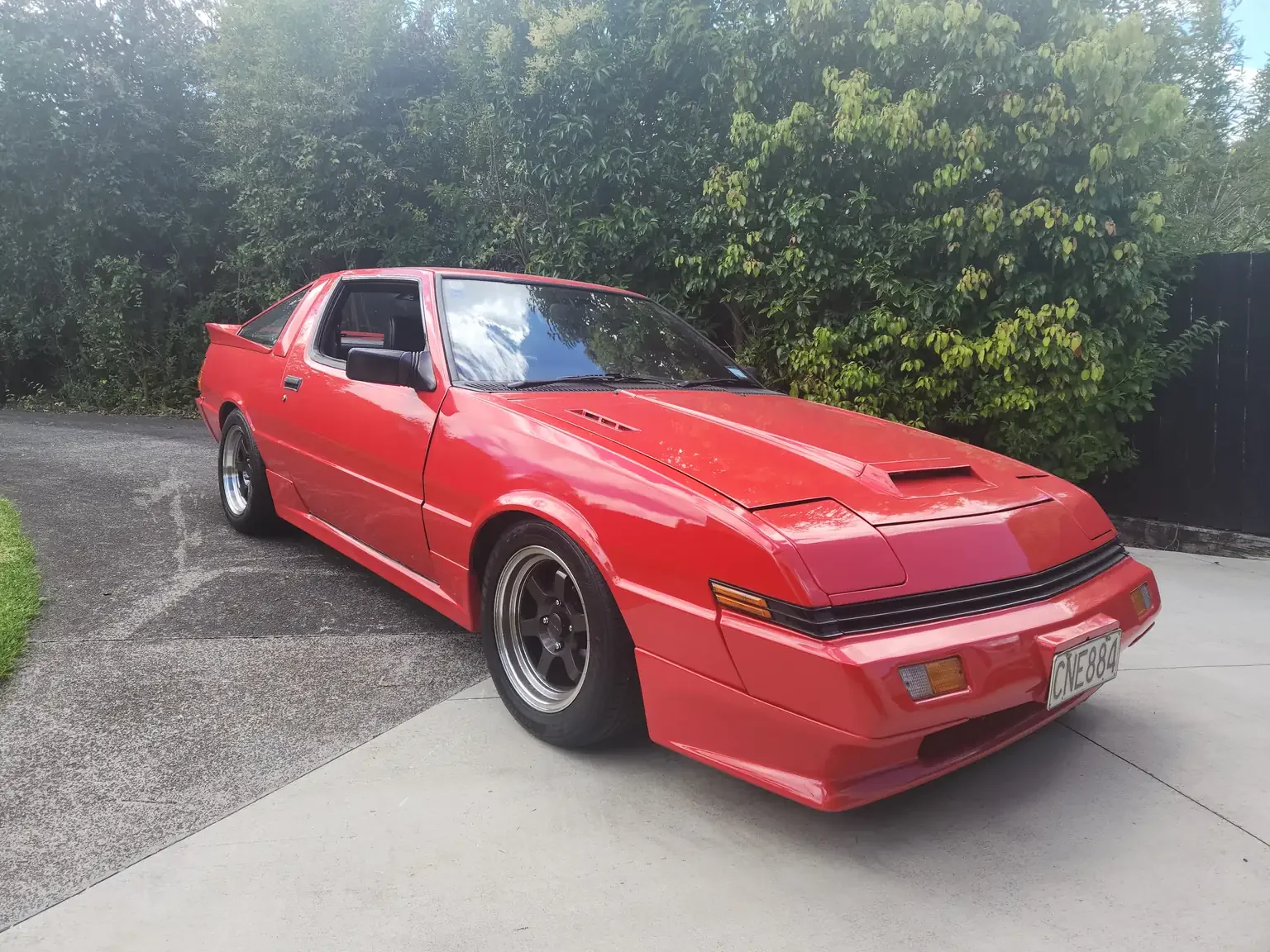 Right hand side corner angle view red Mitsubishi Starion GSR II Turbo JDM spec NZ New export vehicle for sale New Zealand