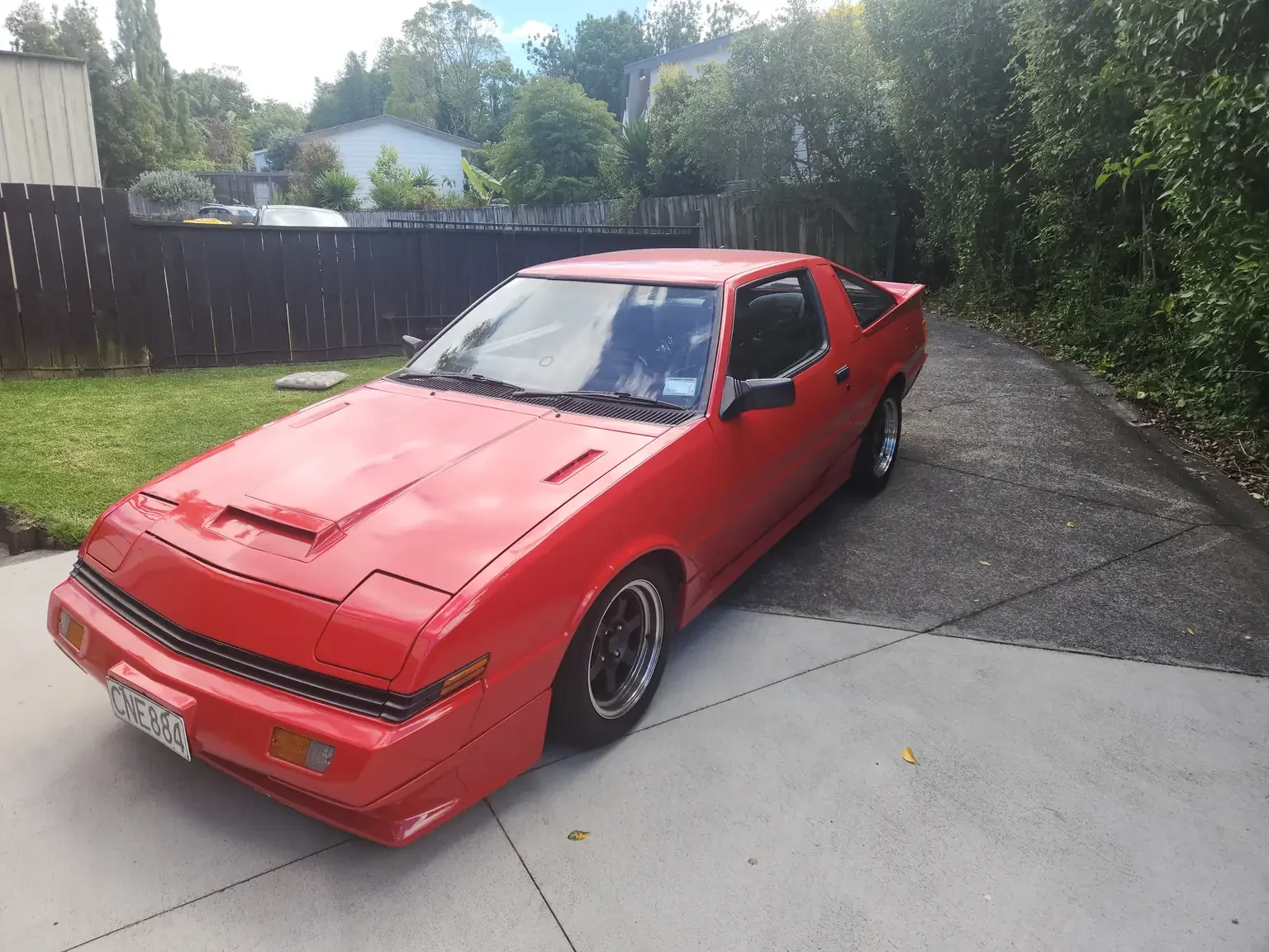 front left corner view red Mitsubishi Starion GSR II Turbo JDM spec NZ New export vehicle for sale New Zealand