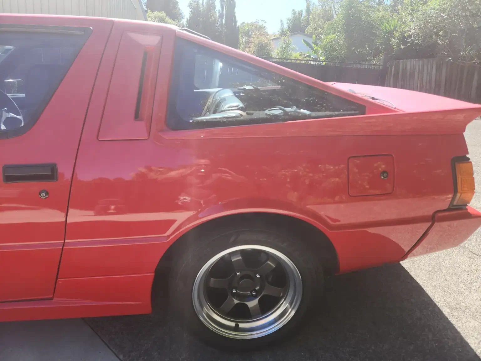 left hand rear quarter condition view red Mitsubishi Starion GSR II Turbo JDM spec NZ New export vehicle for sale New Zealand