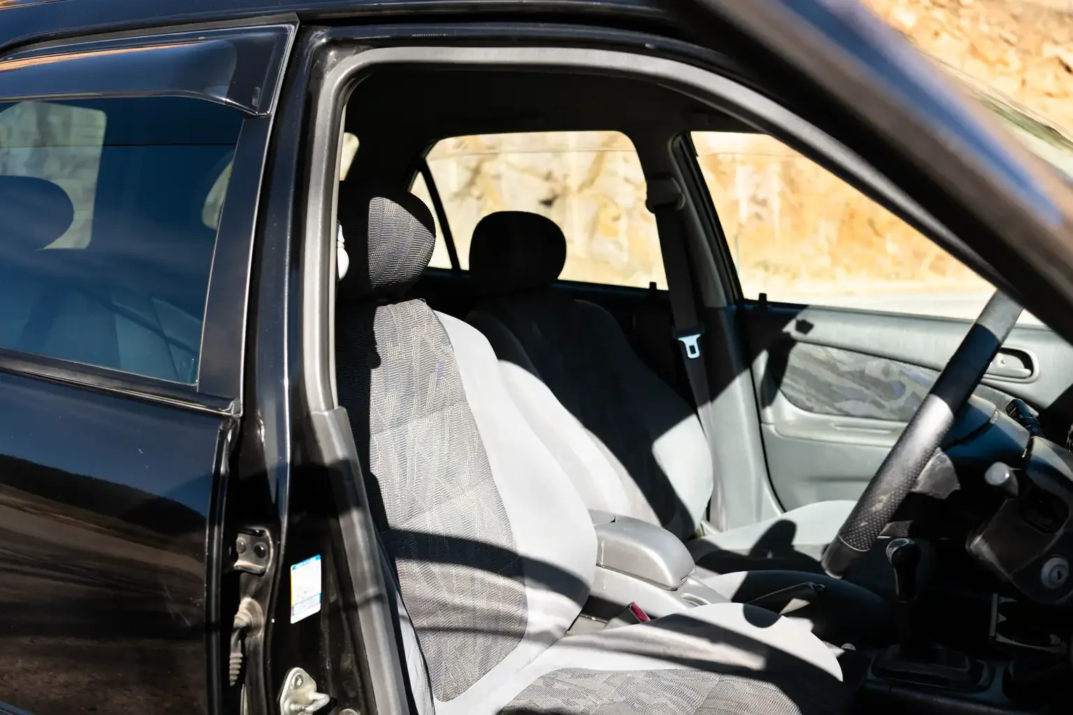 drivers door open showing drivers seat view toyota sprinter carib bz touring 4age 6MT black usa legal jdm vehicle with title for sale colorado USA