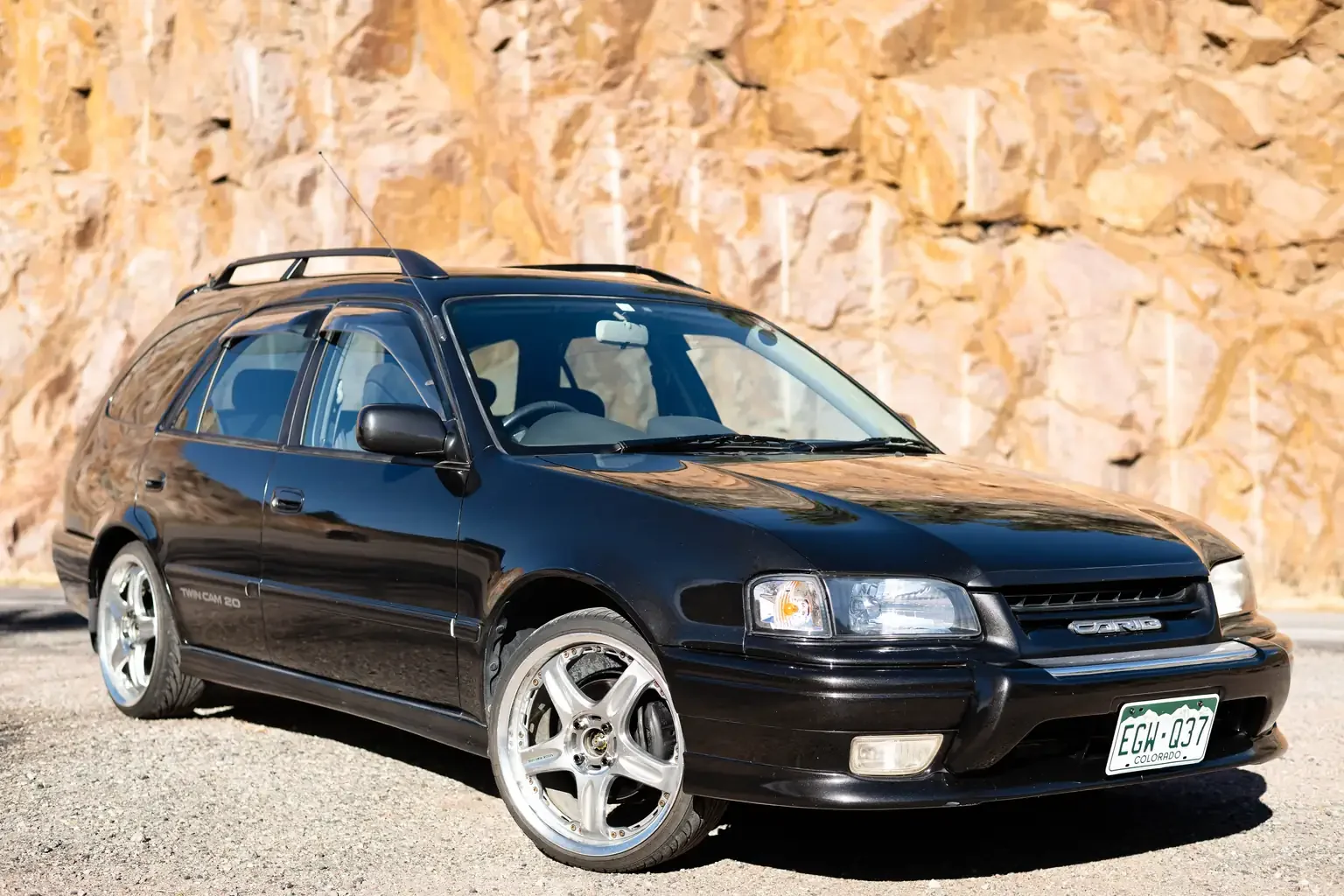 front drivers angle view toyota sprinter carib bz touring 4age 6MT black usa legal jdm vehicle with title for sale colorado USA