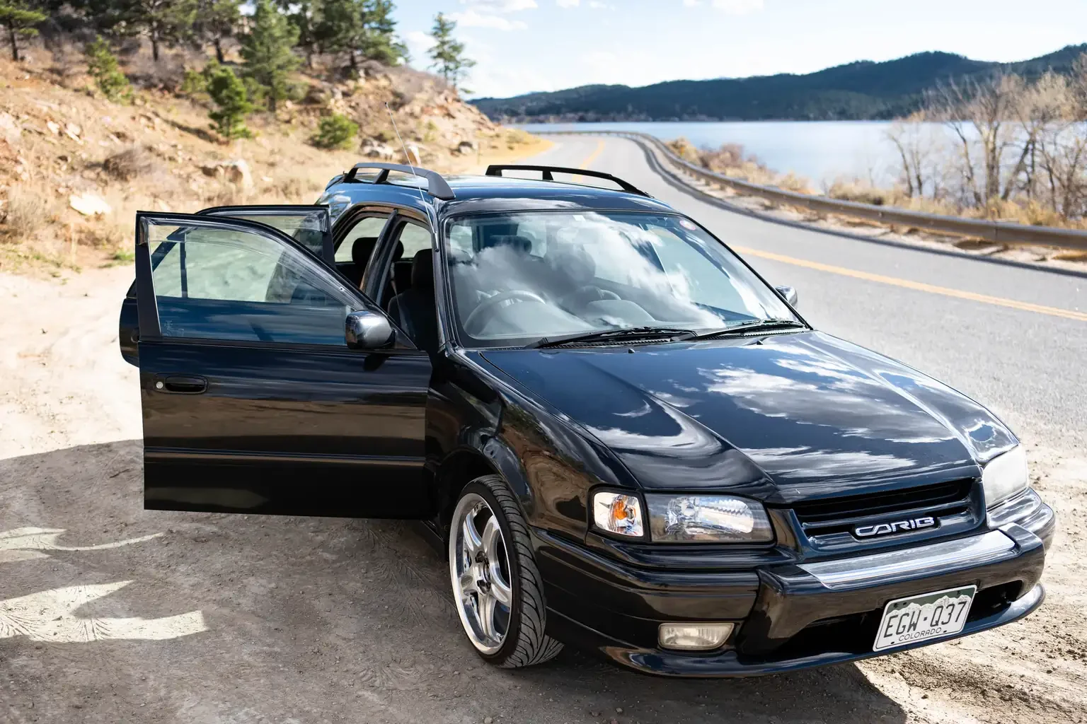 front drivers angle view with doors open toyota sprinter carib bz touring 4age 6MT black usa legal jdm vehicle with title for sale colorado USA