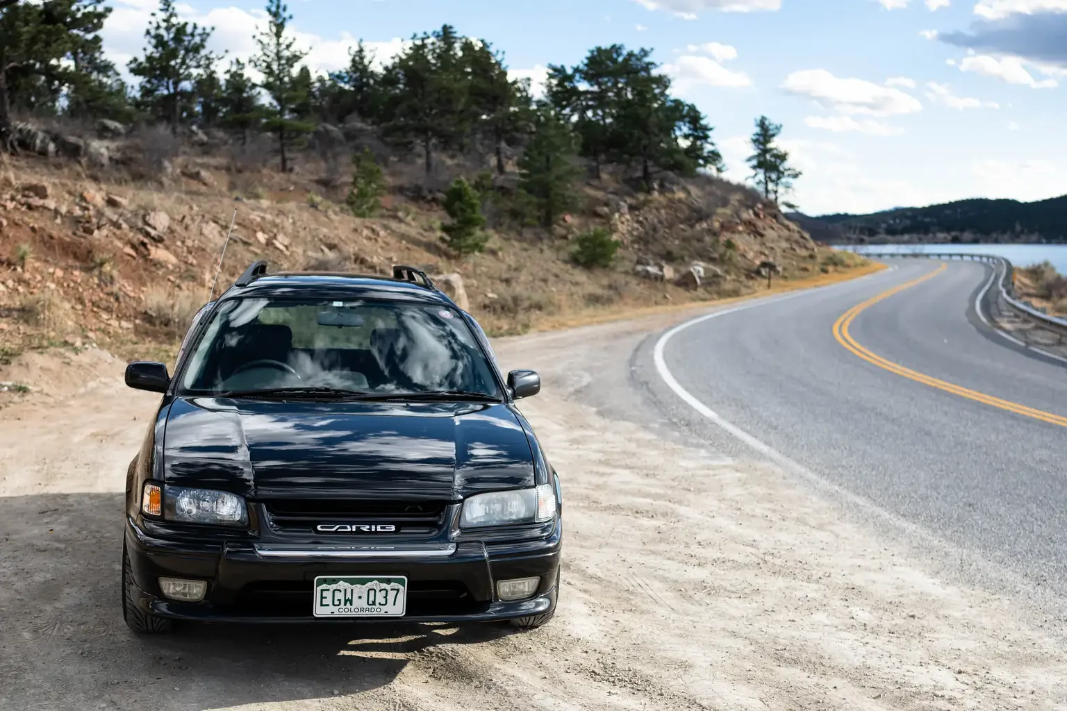 slight angle view of front end view toyota sprinter carib bz touring 4age 6MT black usa legal jdm vehicle with title for sale colorado USA