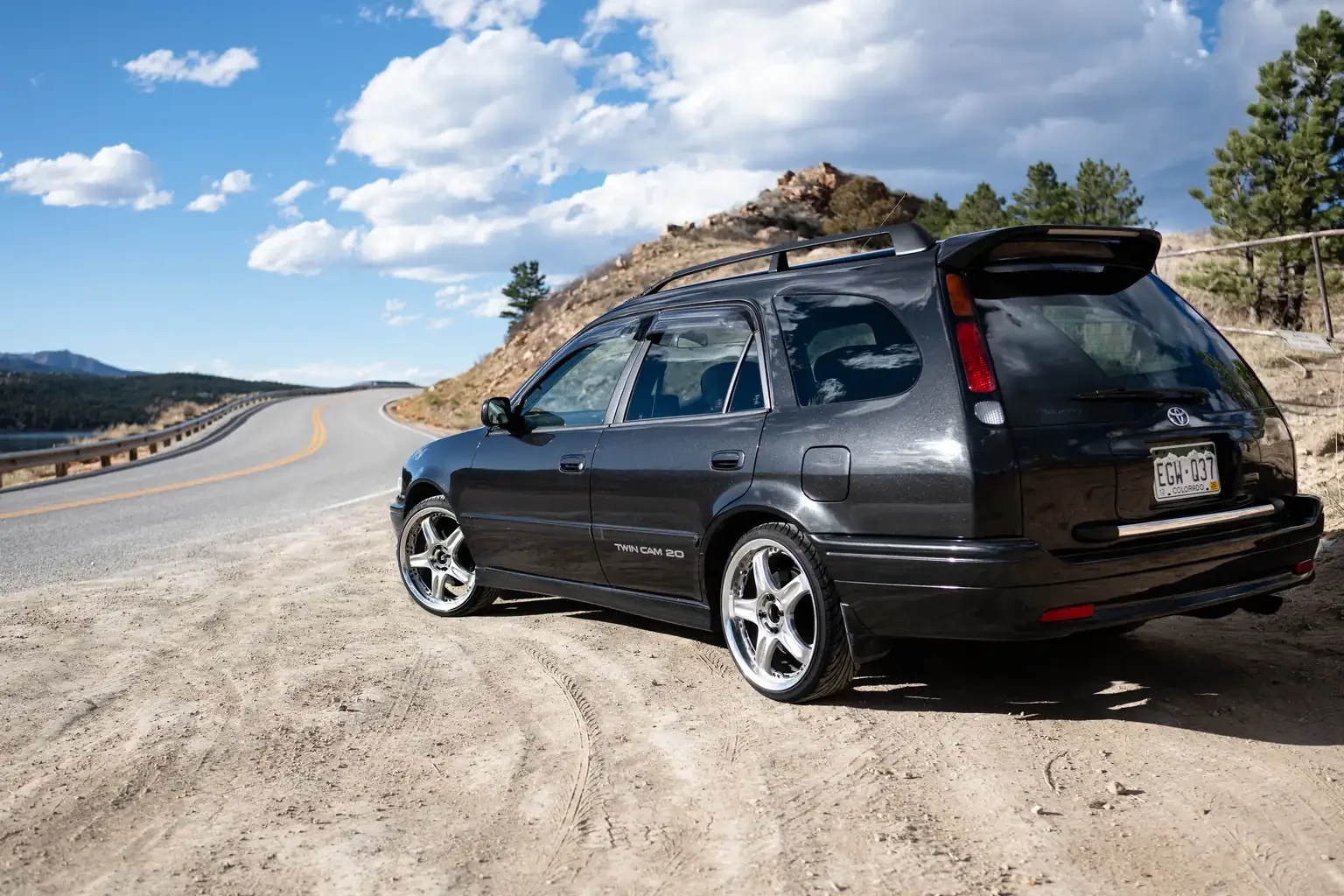 rear passengers angle view toyota sprinter carib bz touring 4age 6MT black usa legal jdm vehicle with title for sale colorado USA