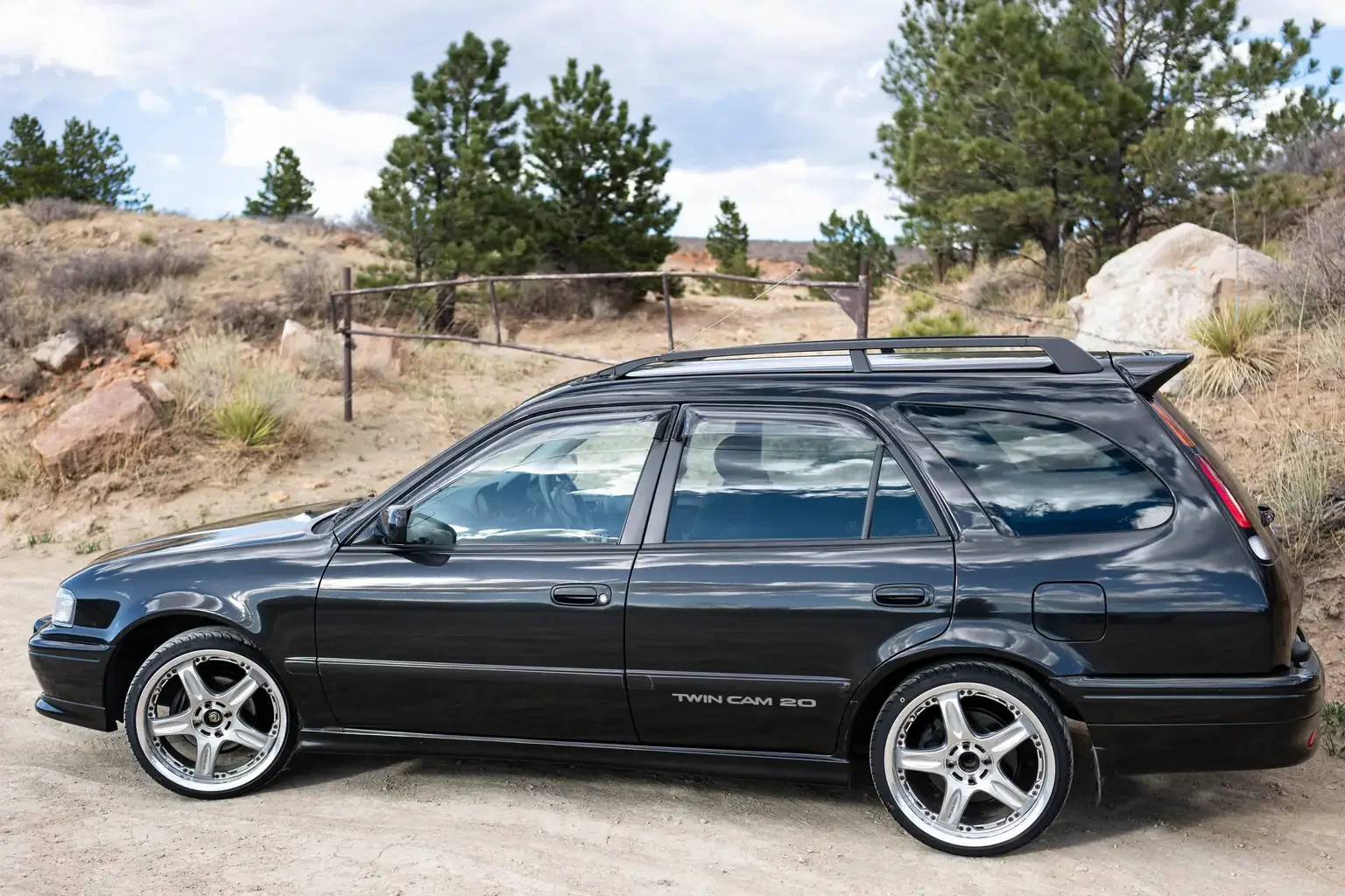 passengers side profile view toyota sprinter carib bz touring 4age 6MT black usa legal jdm vehicle with title for sale colorado USA