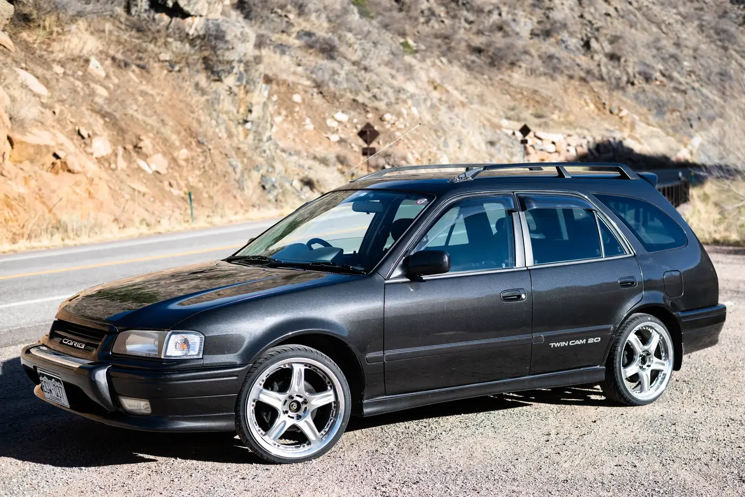 passengers side slight angle view view toyota sprinter carib bz touring 4age 6MT black usa legal jdm vehicle with title for sale colorado USA