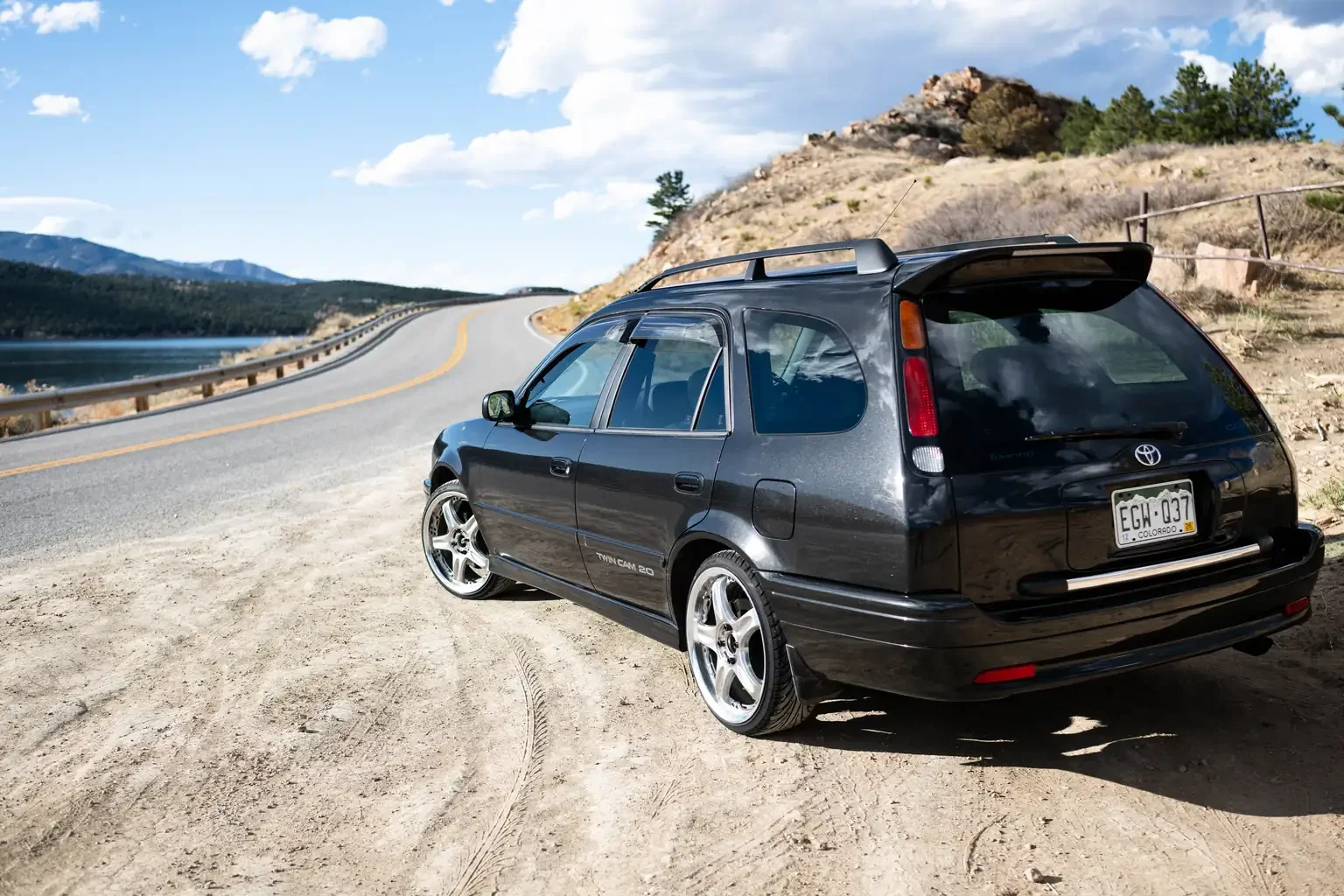 slight angle side profile view toyota sprinter carib bz touring 4age 6MT black usa legal jdm vehicle with title for sale colorado USA