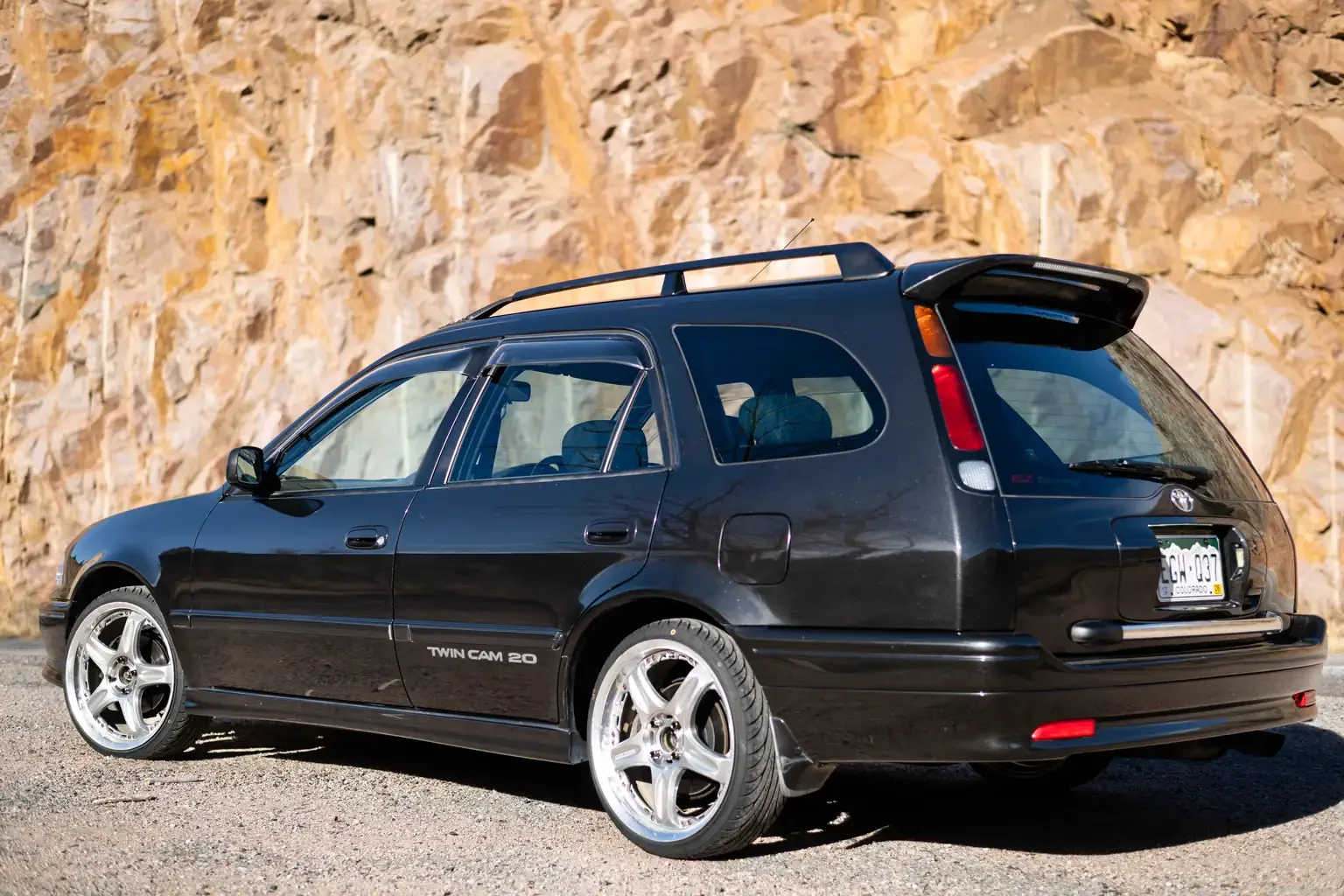 rear passengers angle view toyota sprinter carib bz touring 4age 6MT black usa legal jdm vehicle with title for sale colorado USA