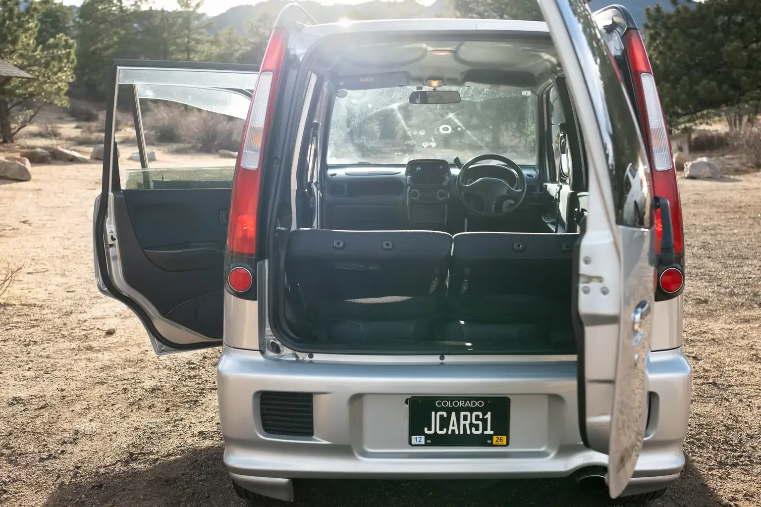 rear tail gate open showing interior view silver daihatsu move custom aero down xx turbo usa legal jdm vehicle with title for sale colorado USA
